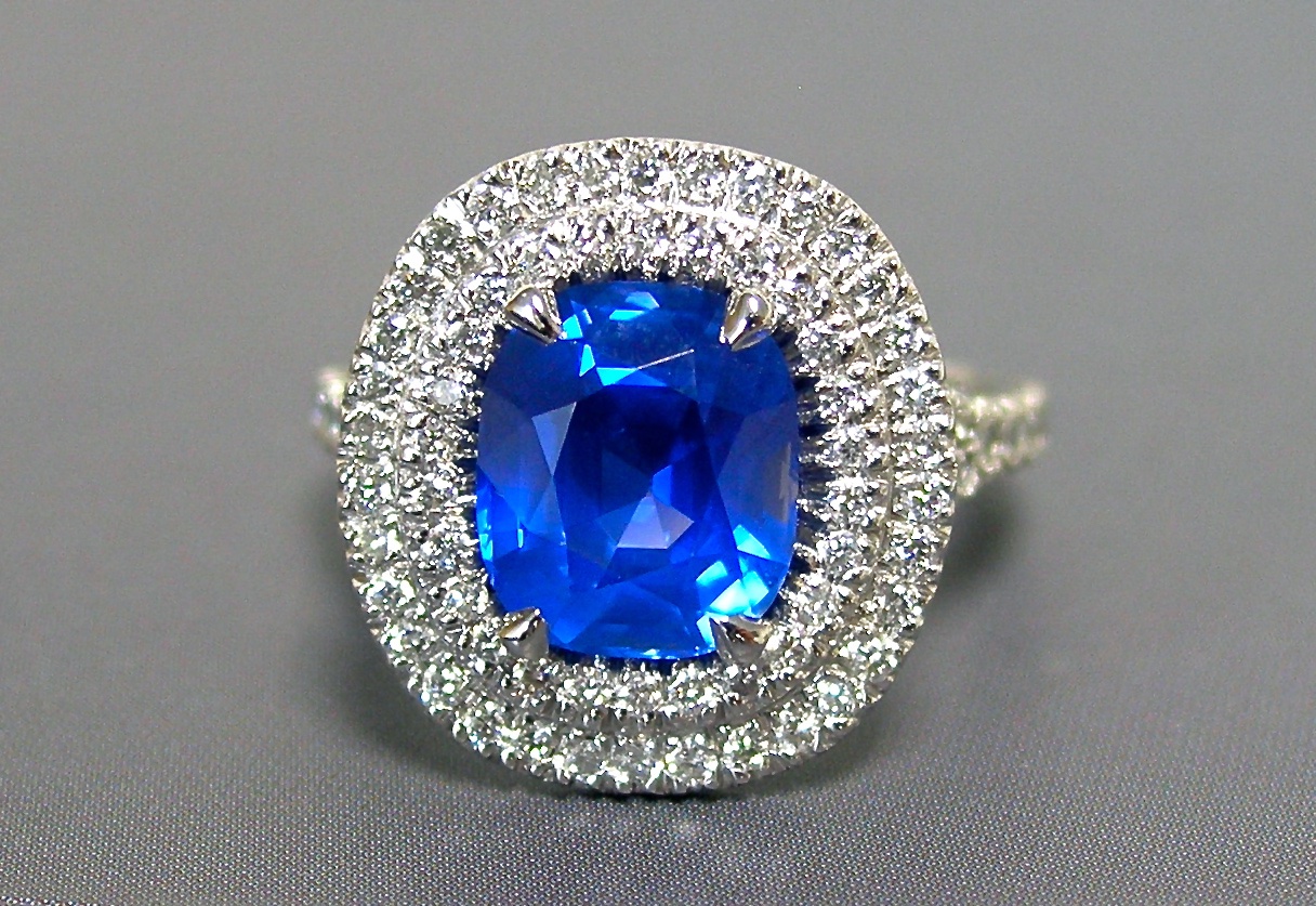 A 5+ carat sapphire & diamond double halo ring