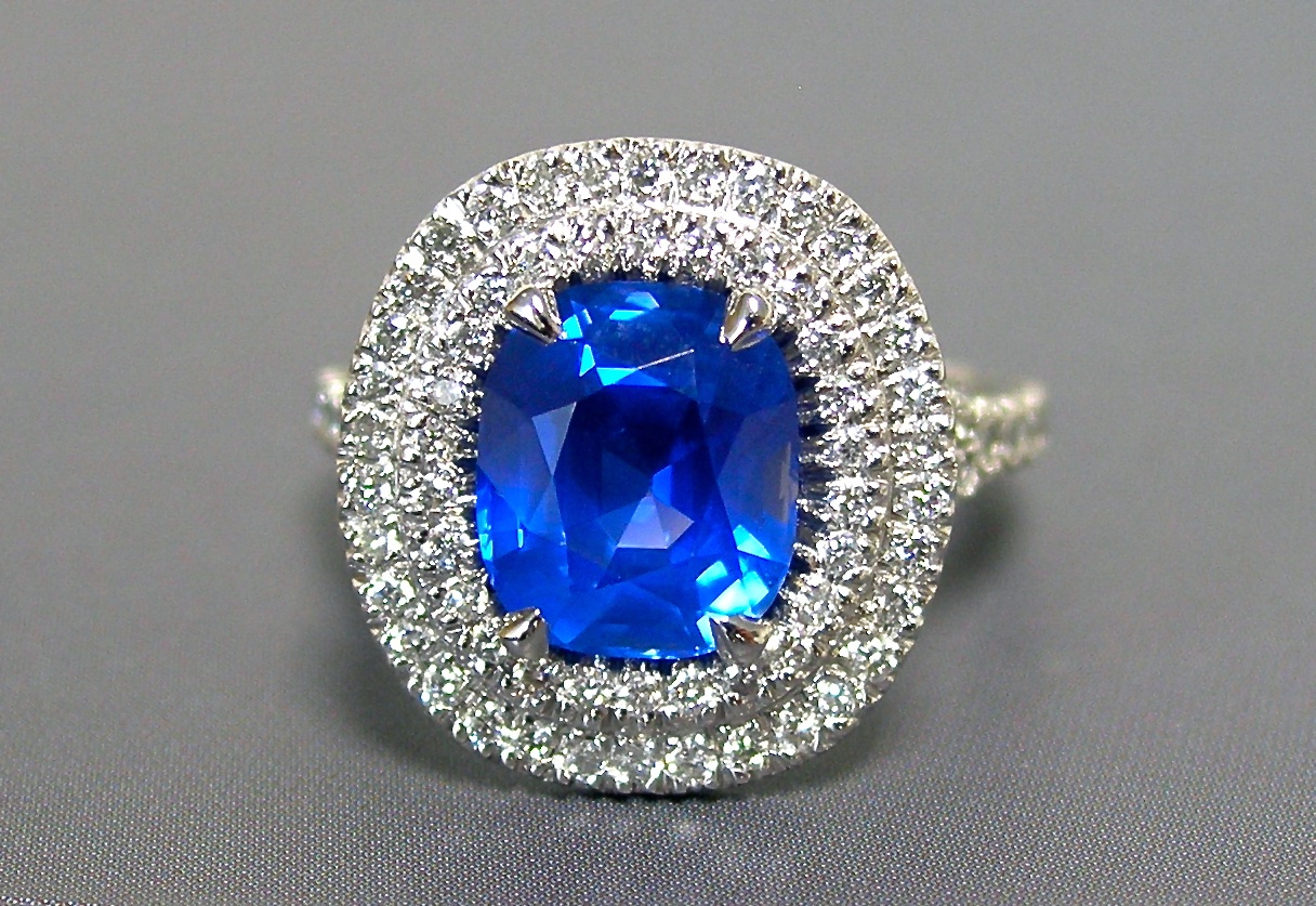 A 5+ carat sapphire &amp; diamond double halo ring 