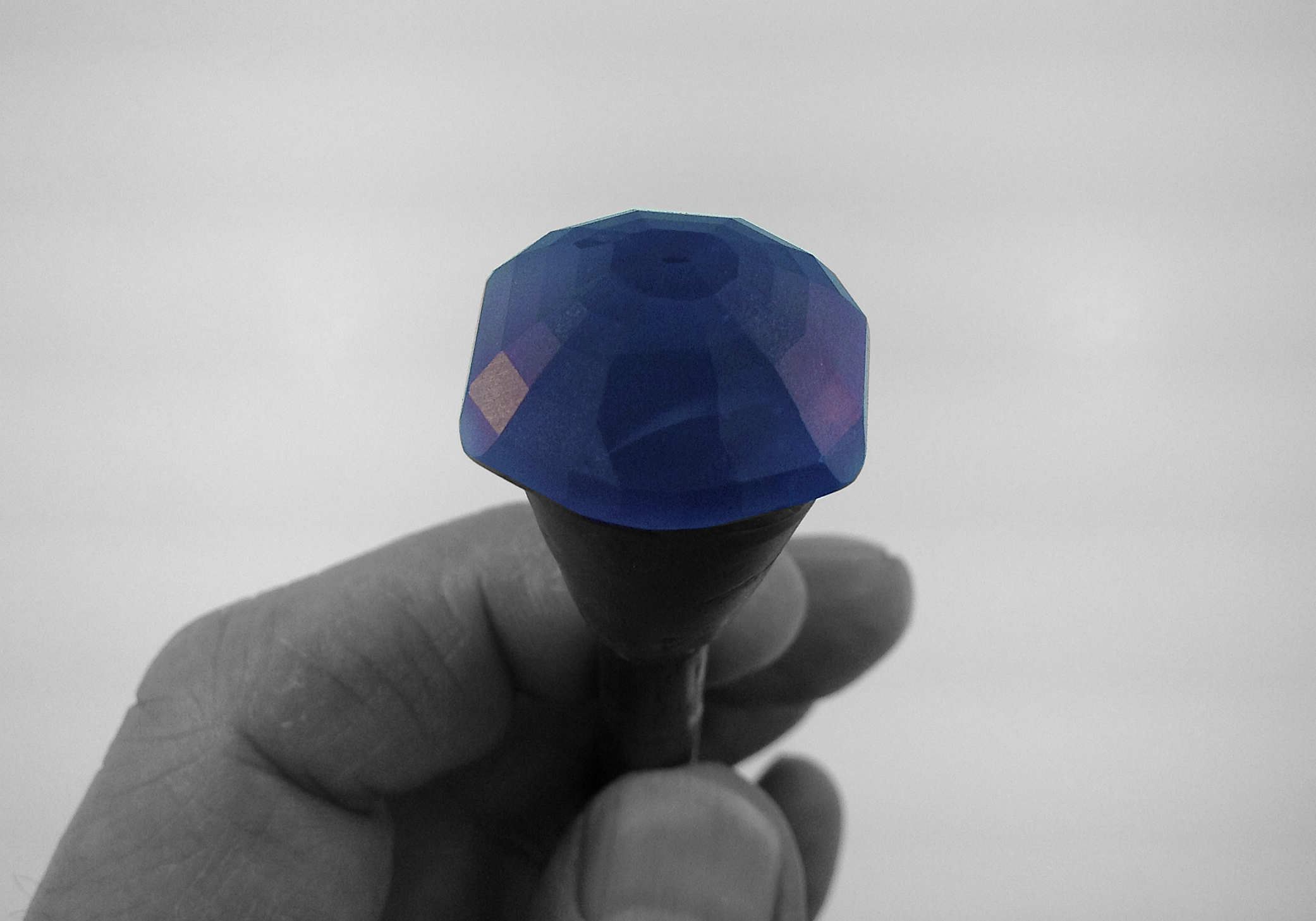 A 50 + carat fancy shaped sapphire on the "stick."