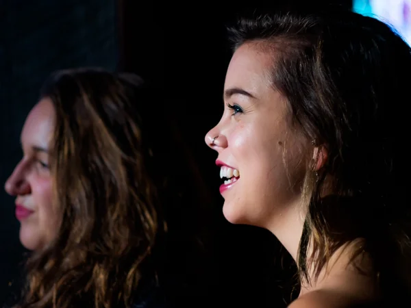 Desirée Wallace, who interned for HOPE International Development Agency over the summer, watches Jacky Essombe perform at HOPE International Development Agency fundraising event to benefit children orphaned by AIDS in Ethiopia, held at The Blarney Stone Pub, Vancouver, BC, Canada on November 3, 2013.