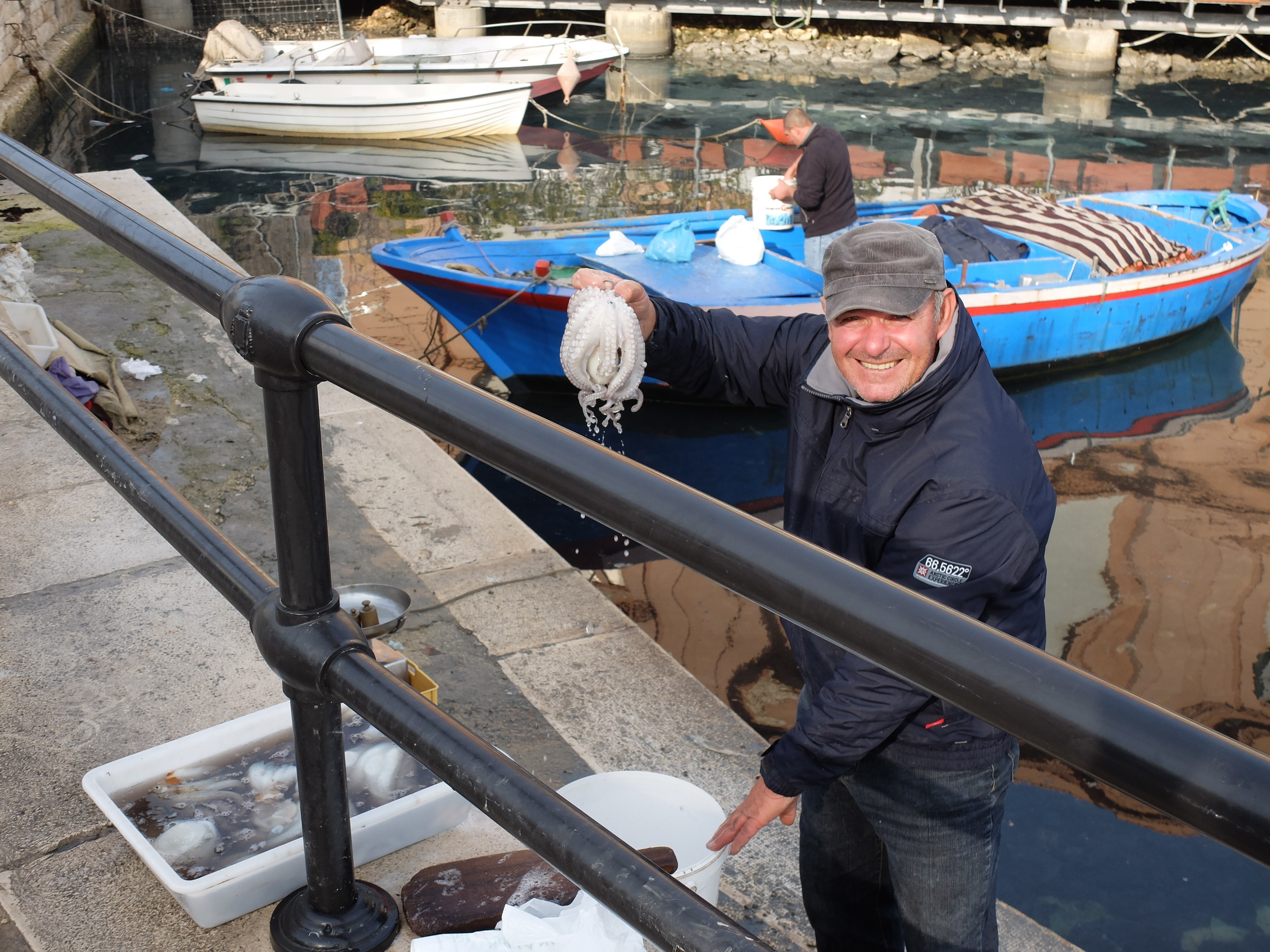 Fisherman showing off his catch, Bari