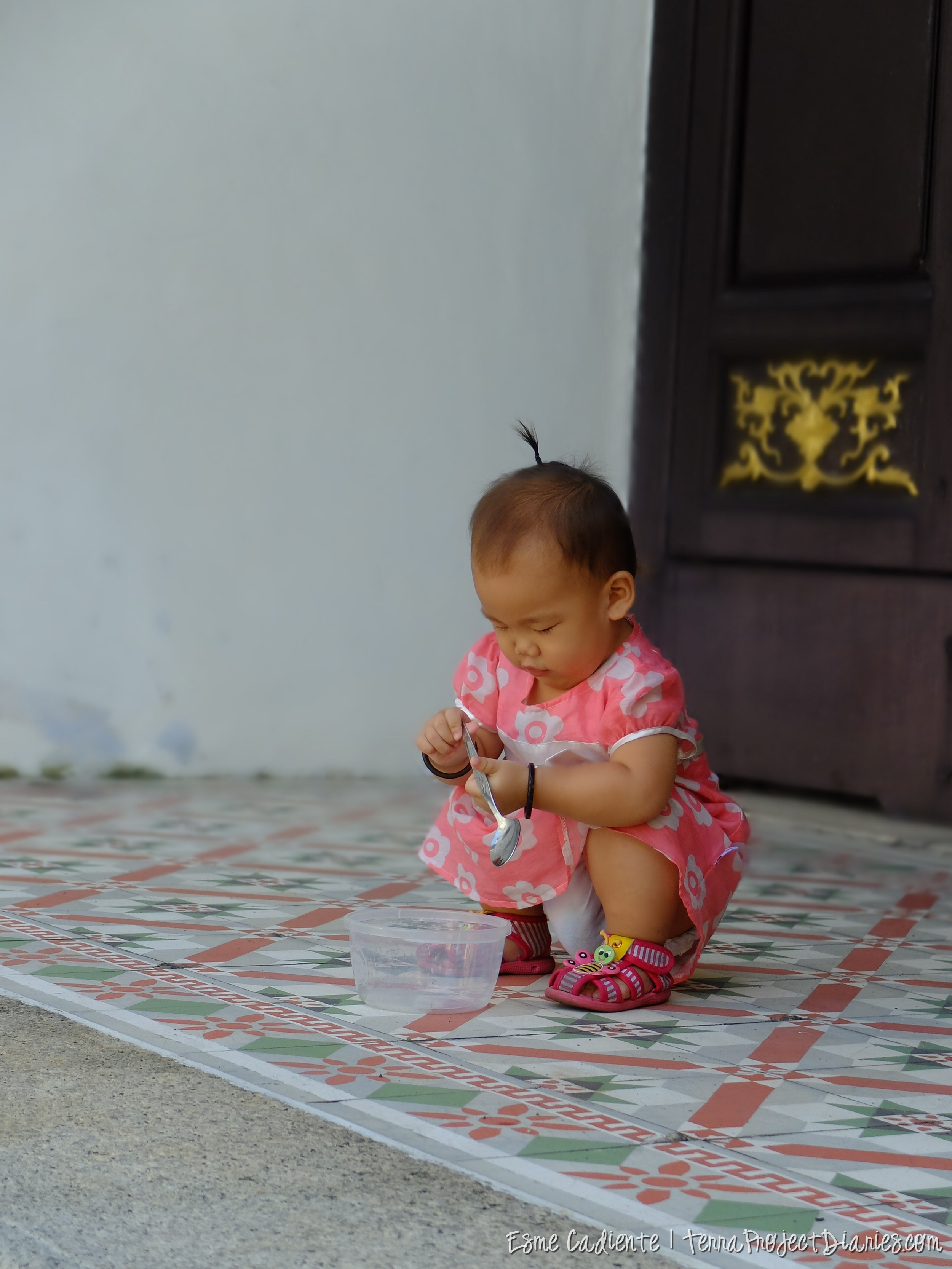 Chinese baby playing in a temple