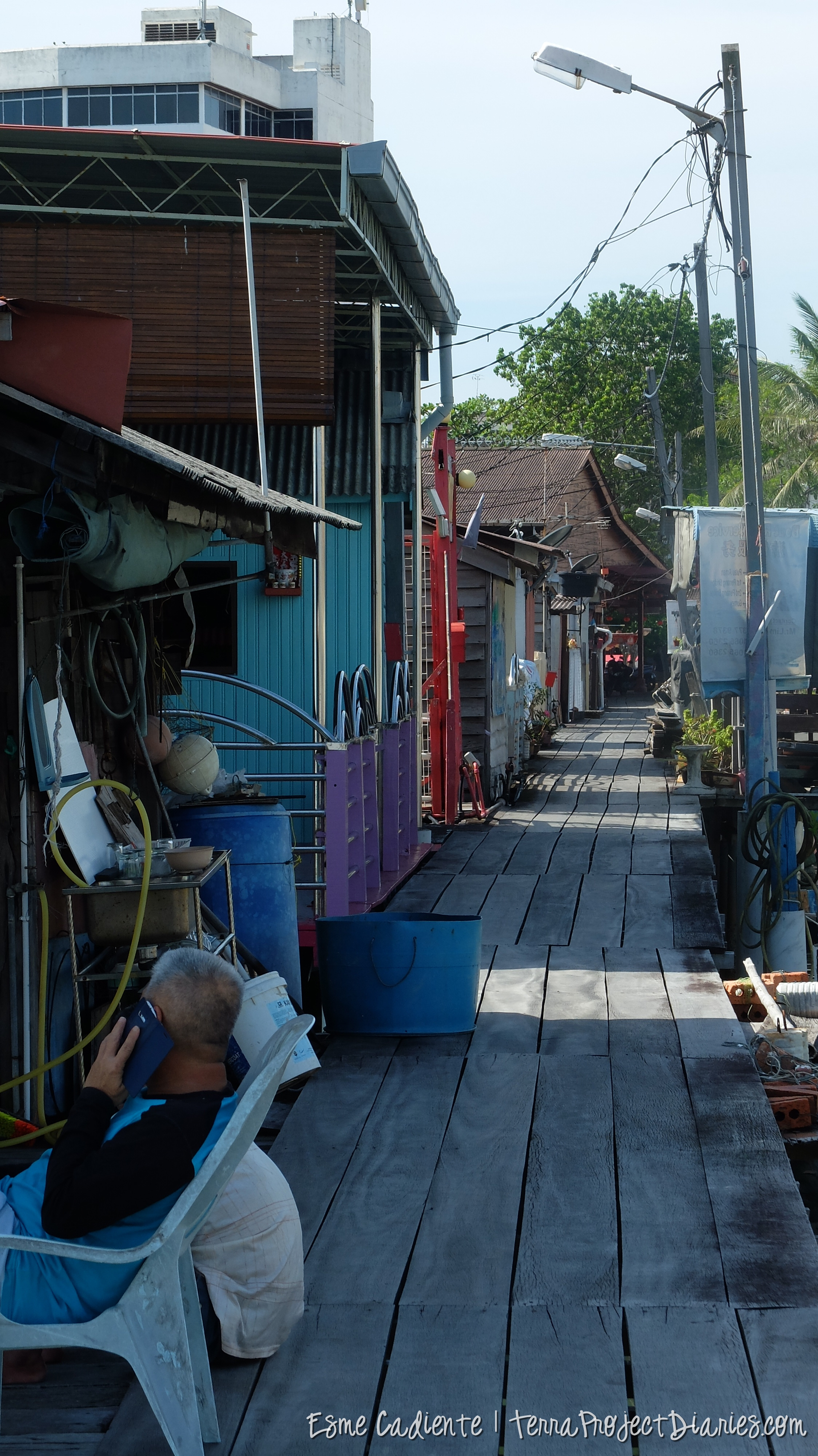 A man outside his home, floating villages, Penang
