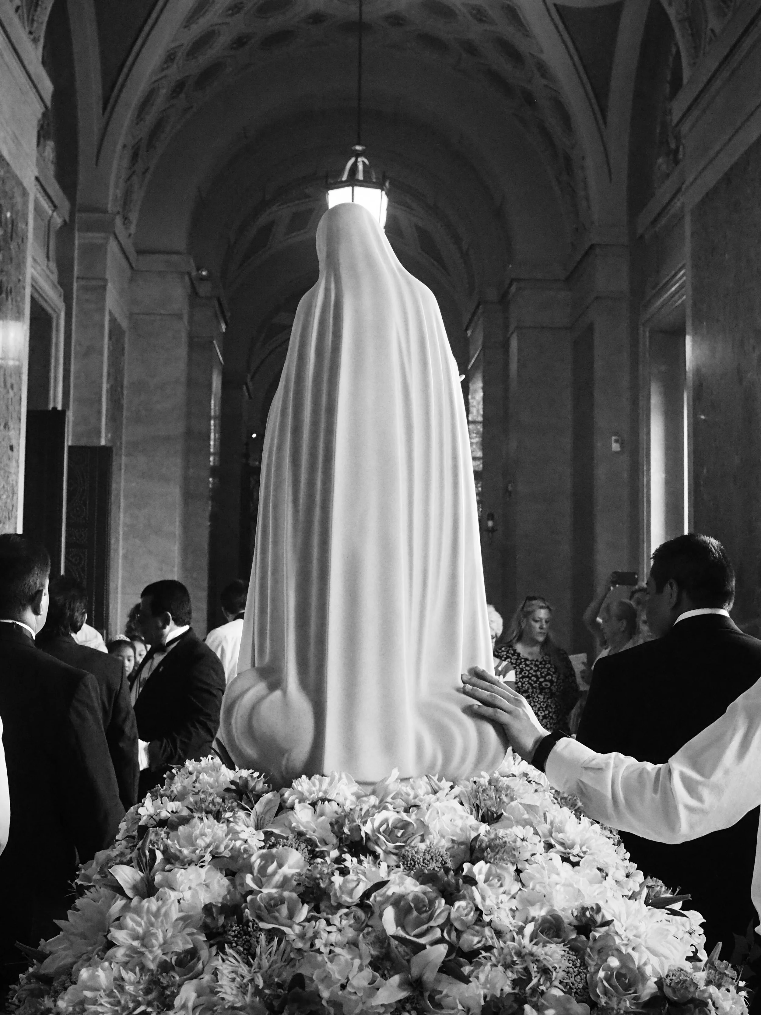 Hand on Mary. Rosary Procession. Saint Paul, MN.