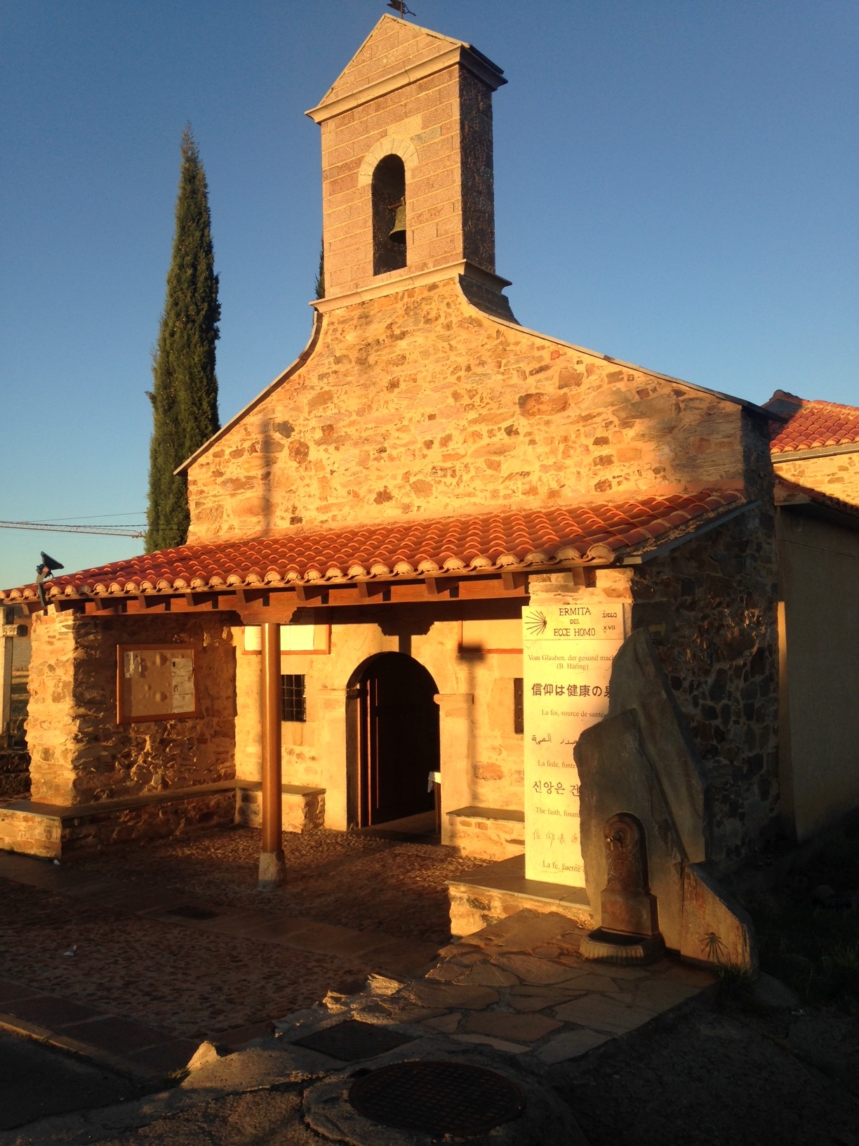I like comparing the grandiose cathedrals with the tiny hermitages I'd pass along the way. Even though it was sunrise, this medieval chapel, Ecce Homo, was manned by a friendly elderly woman who tried to tell me the story of the chapel's well. From what I gathered a miracle happened, but my Spanish wasn't up to the task of sorting out what type of miracle. So I blessed myself and looked as the display of antique photos of parishoners past. As I was leaving the tiny woman mimed my putting on my backpack and trudging away. She must see a lot of us droopy pilgrims.
