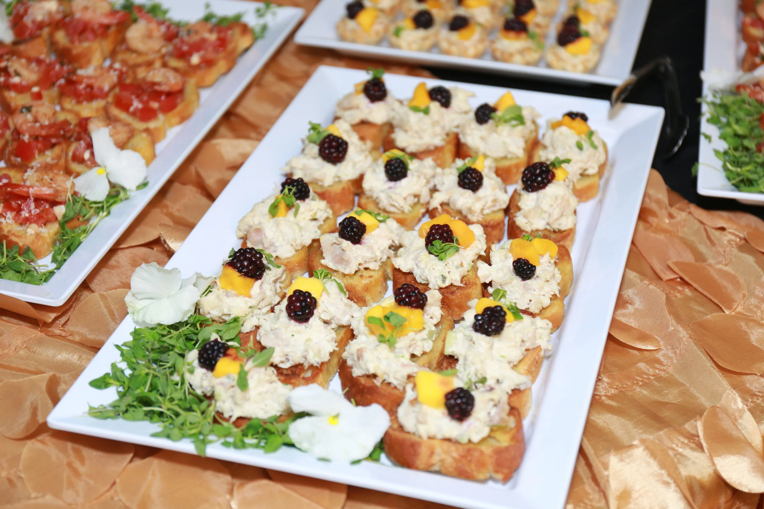 Chicken Salad Crostini topped with Mango and Blackberry
