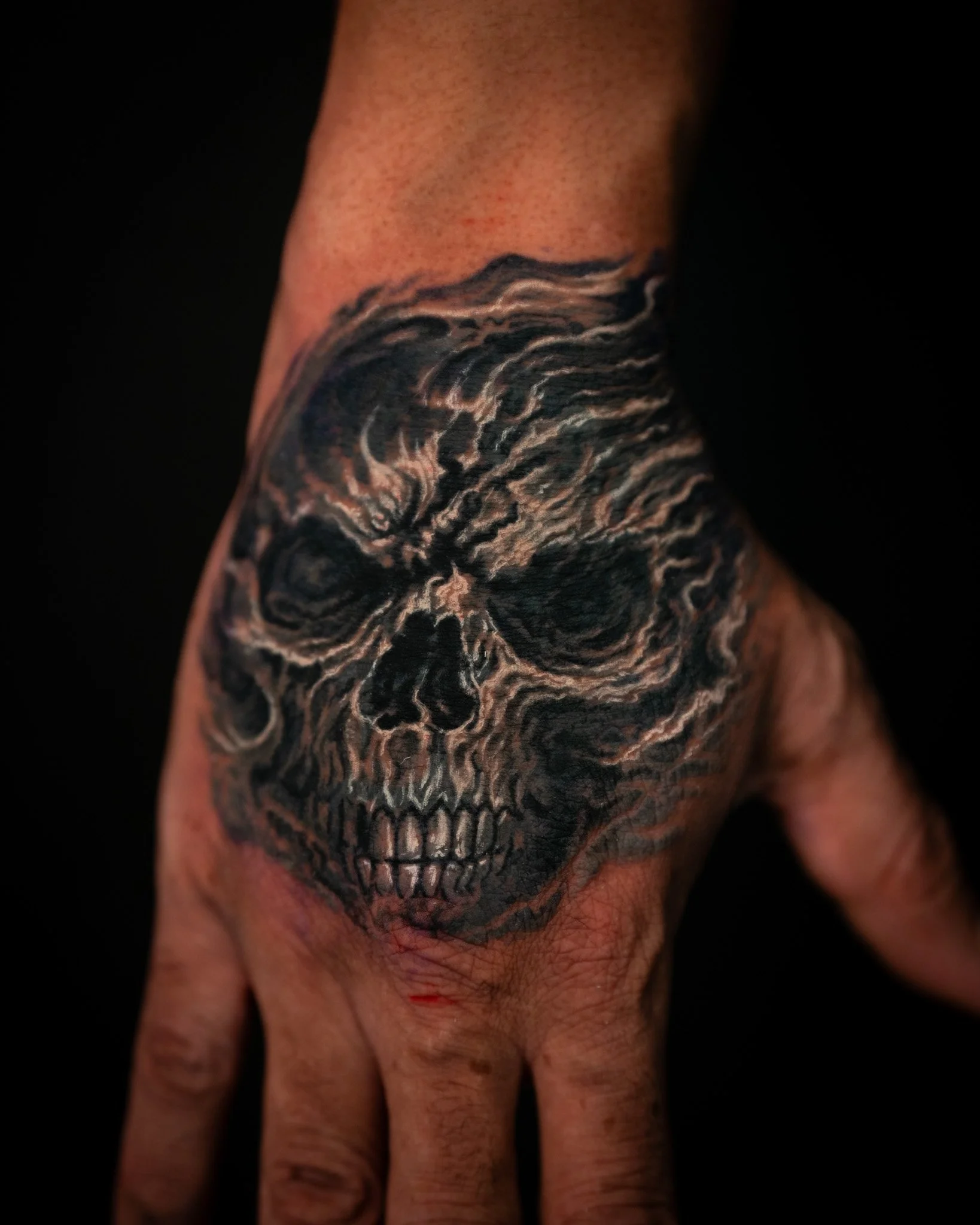 cover-up-skull-hands-tattoo-toronto.JPG