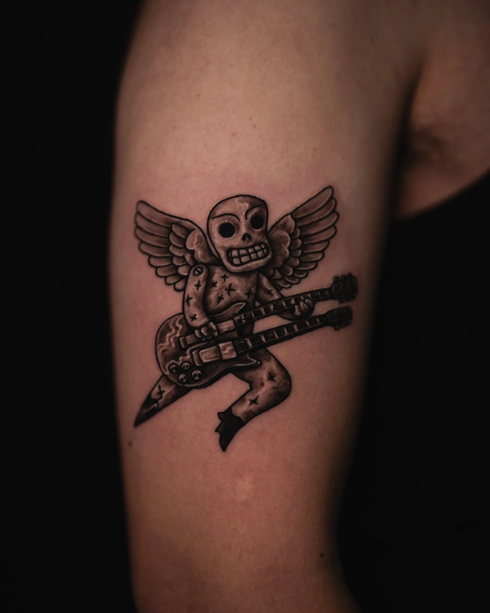 small-skull-guitar-tattoo-toronto.JPG