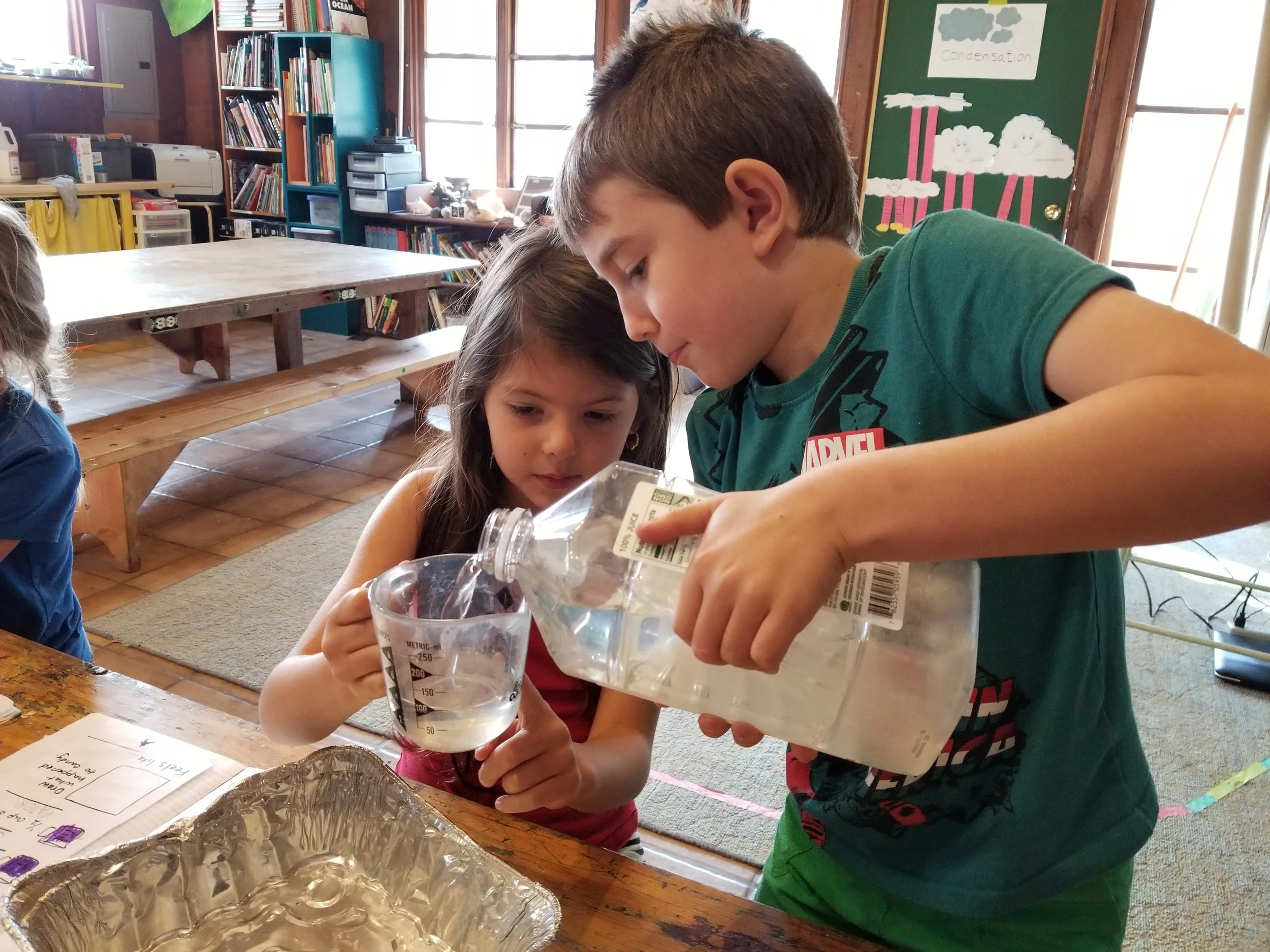 Measuring water for oobleck.