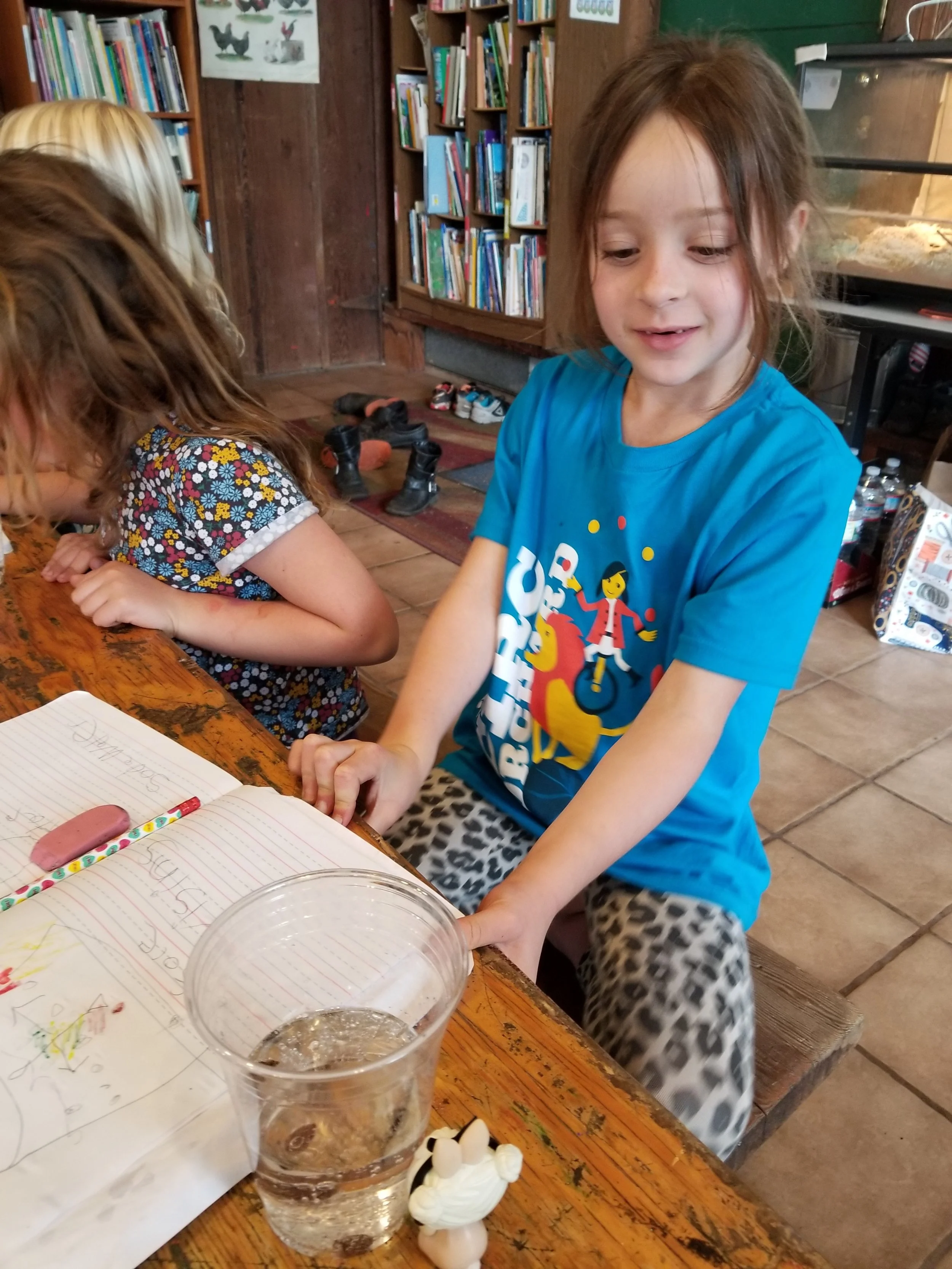 Katha was the first to notice that the raisins  "get charged up" at the bottom of the cup.