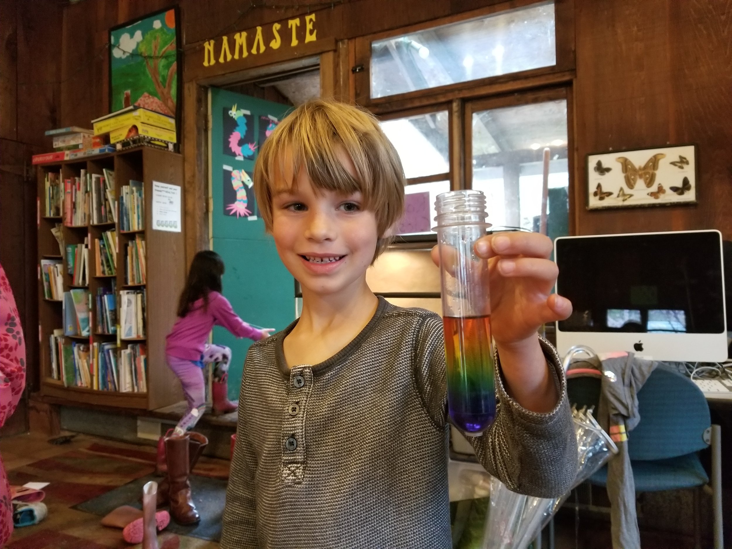 Ezra was very patient in carefully adding the layers of decreasingly sugary water to create a rainbow.