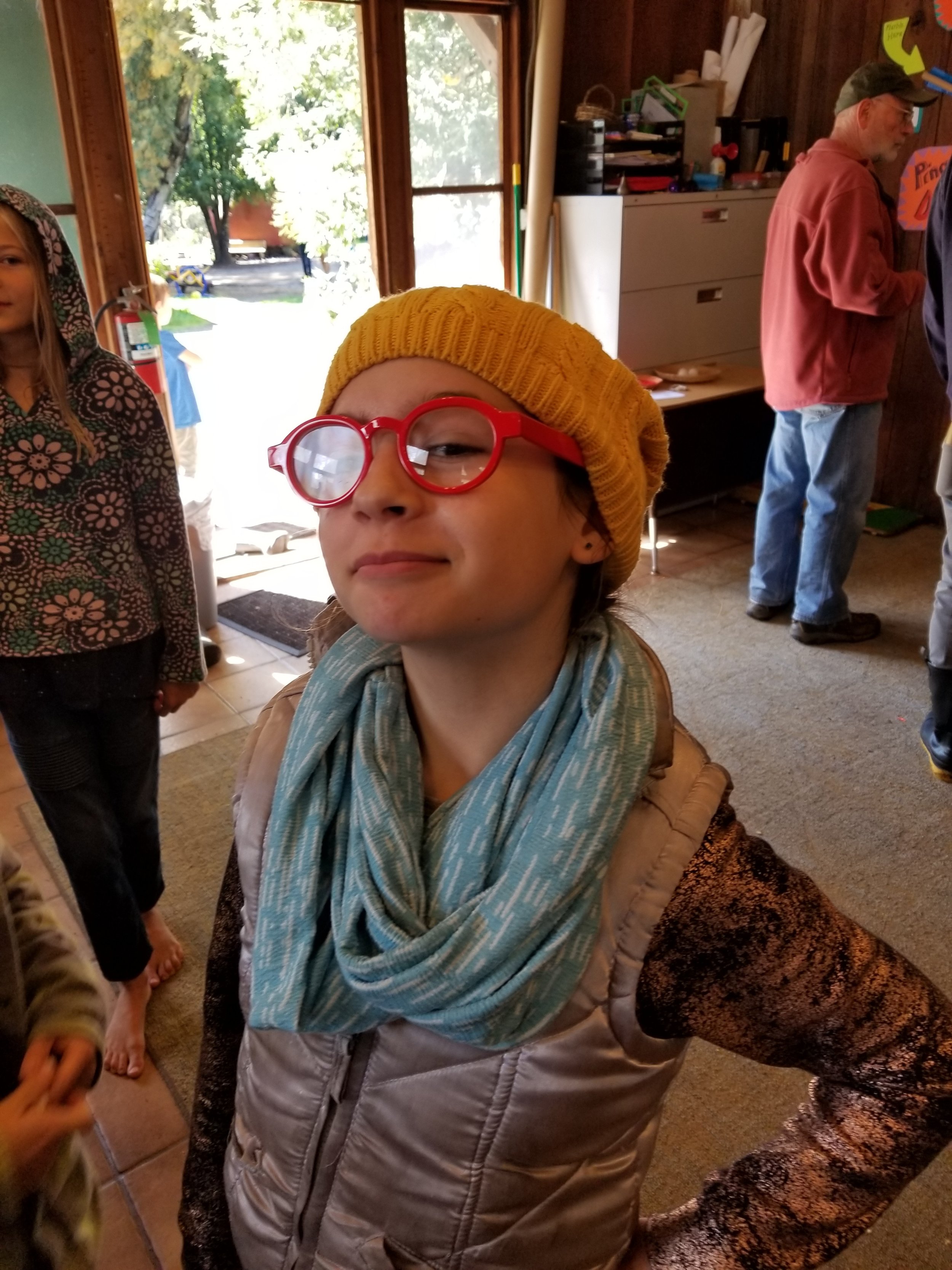 Nia models some lenses that Jack brought to illustrate how glasses work.&nbsp;