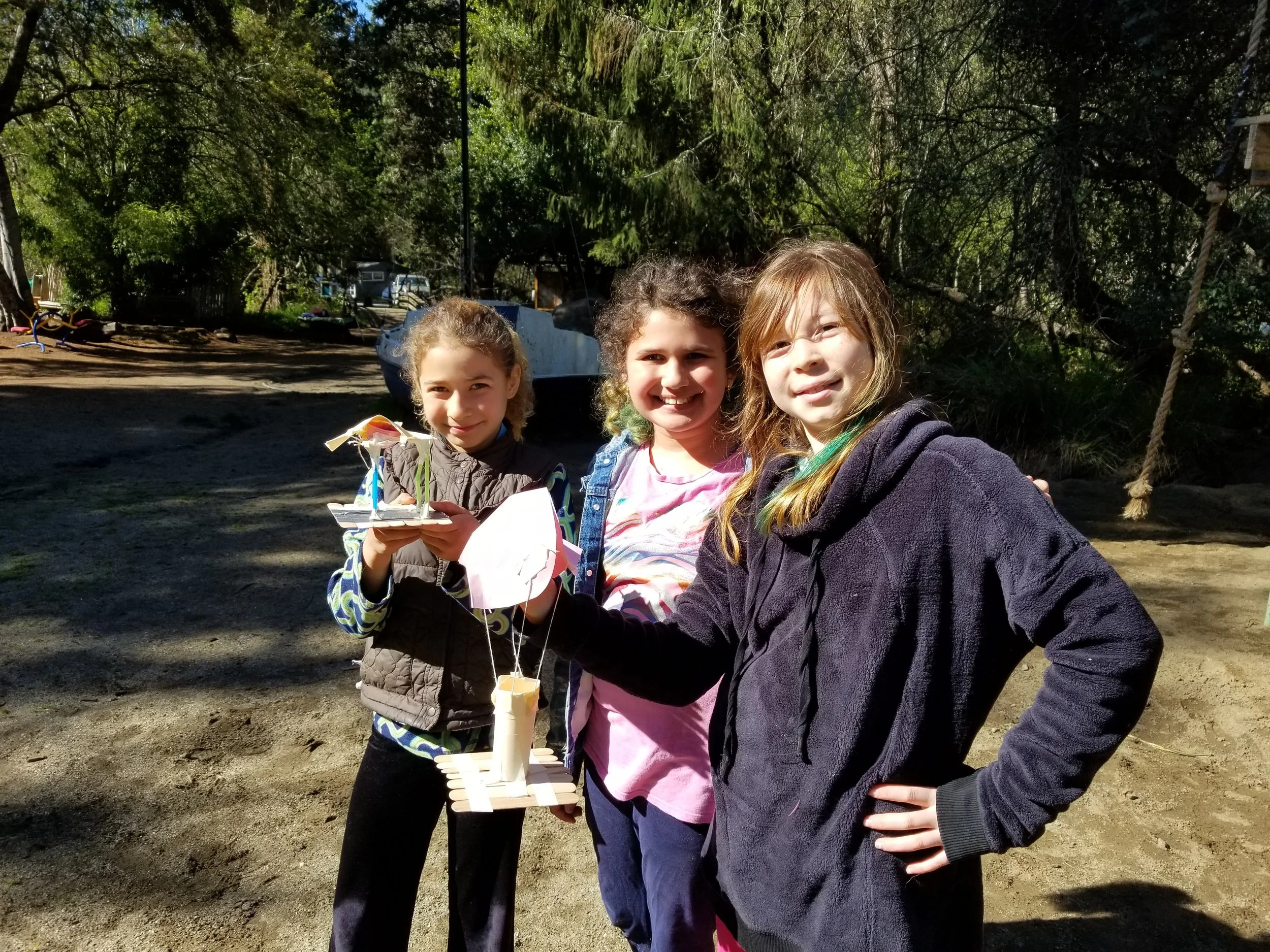 Showing off their designs.