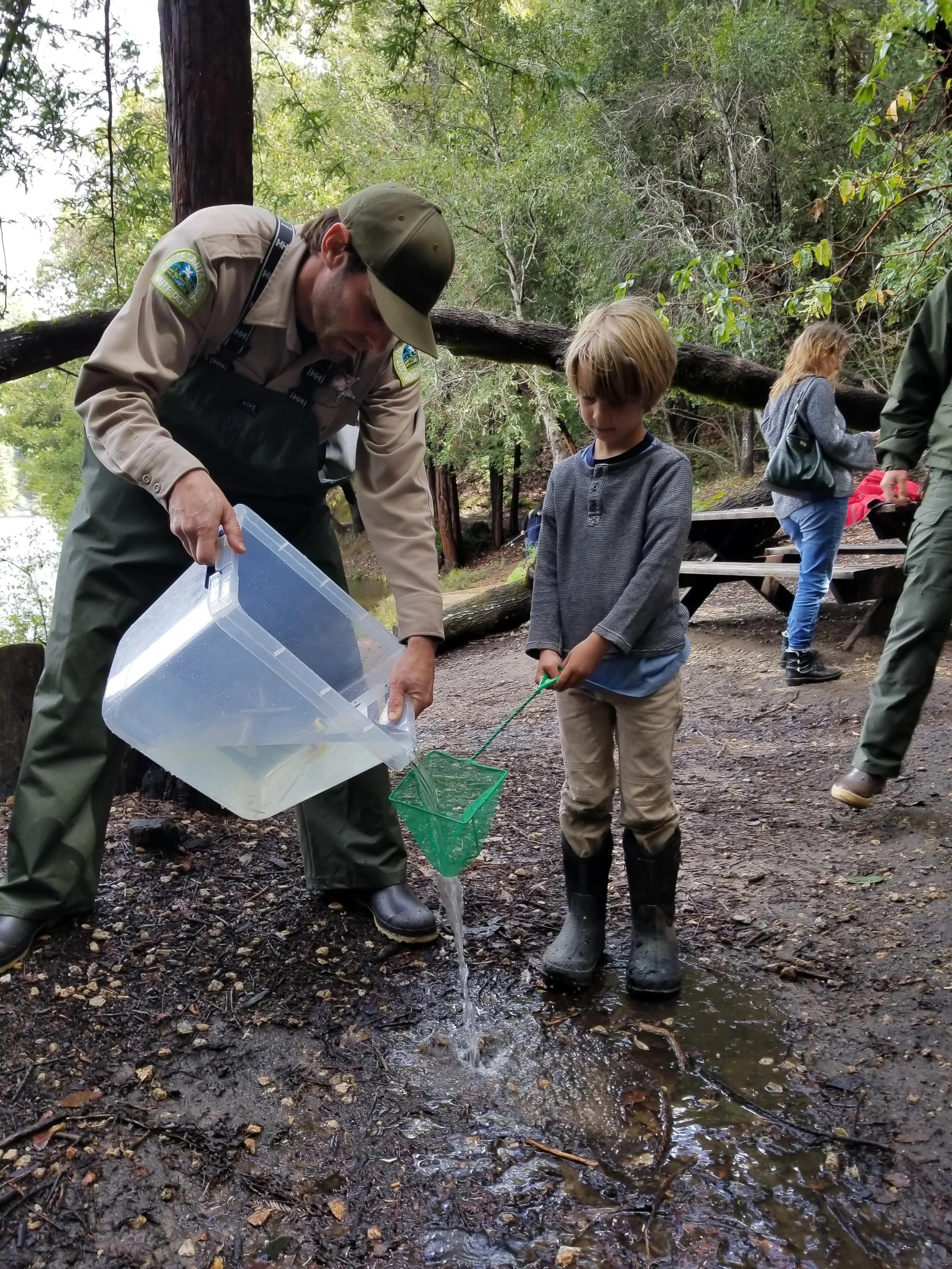 A few times we had to pour a little water out. Ezra is there to catch any potential escapees (there were none).&nbsp;