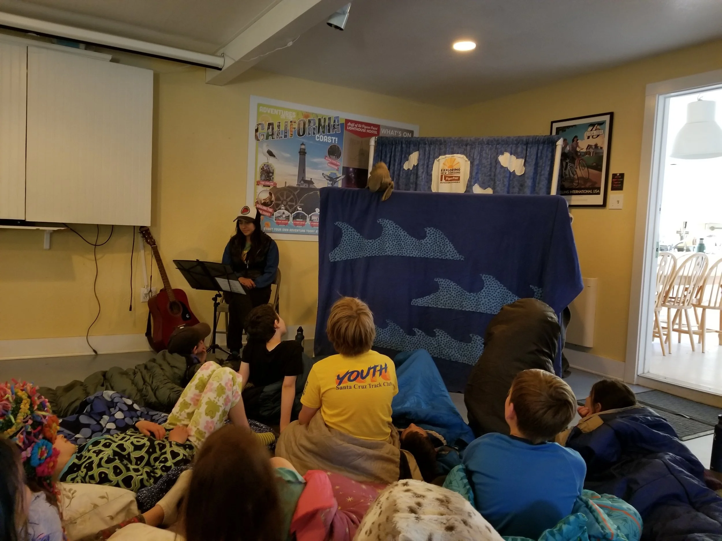 Here, Oscar the elephant seal educates the students through song about what brings him to Ano Nuevo.&nbsp;