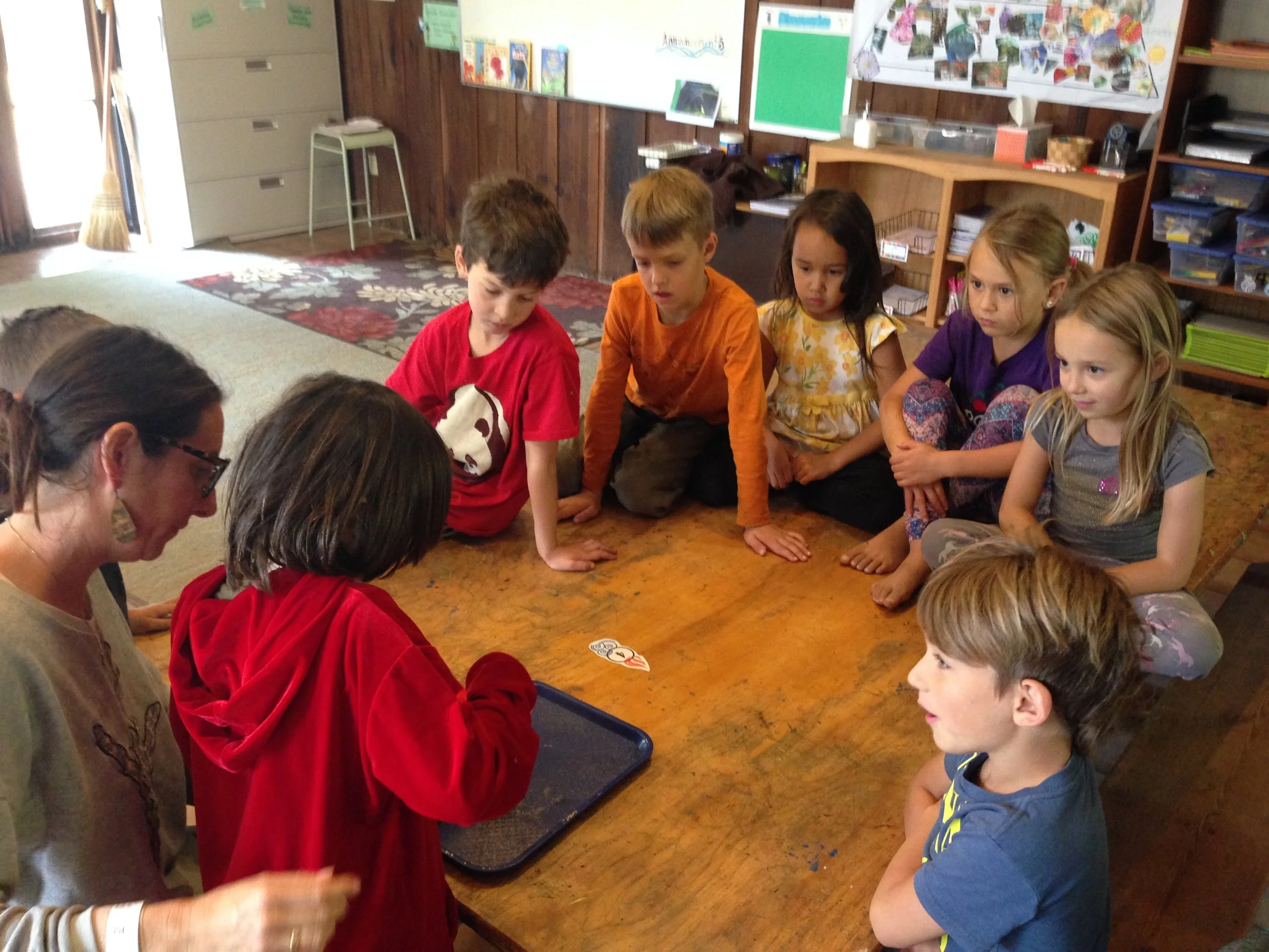 Shana and Bear dissecting a mysterious object that they found on the beach.