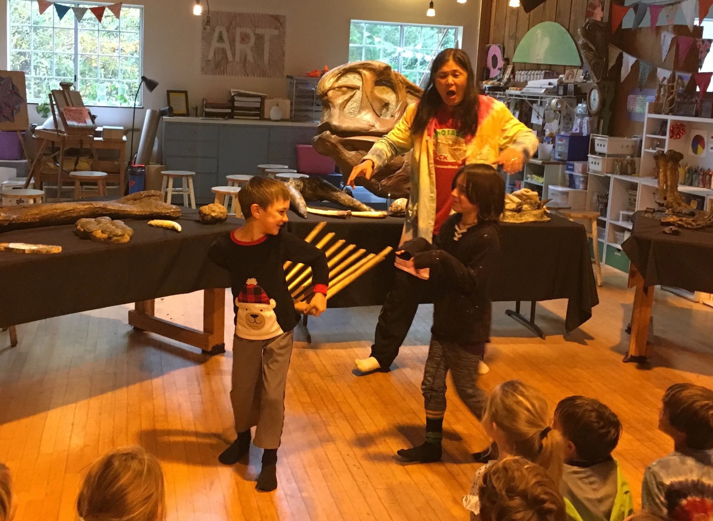 Jacen demonstrating how a dinosaur defends himself against a T-Rex.