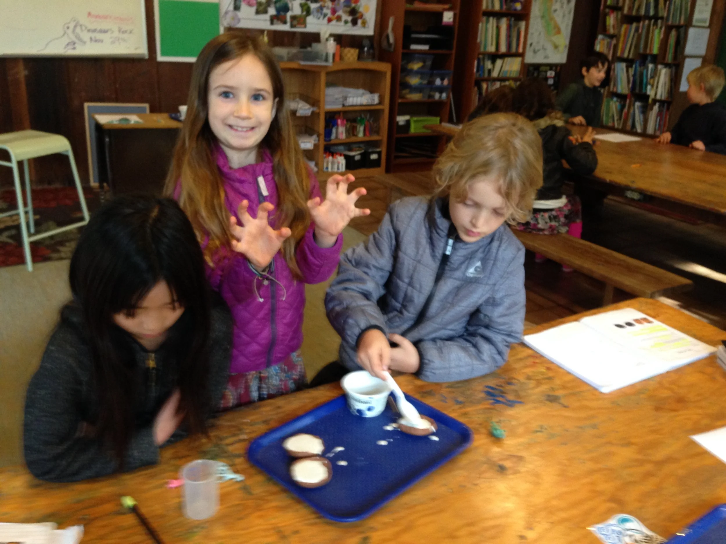 Using clay as our mold and plaster to create the cast.