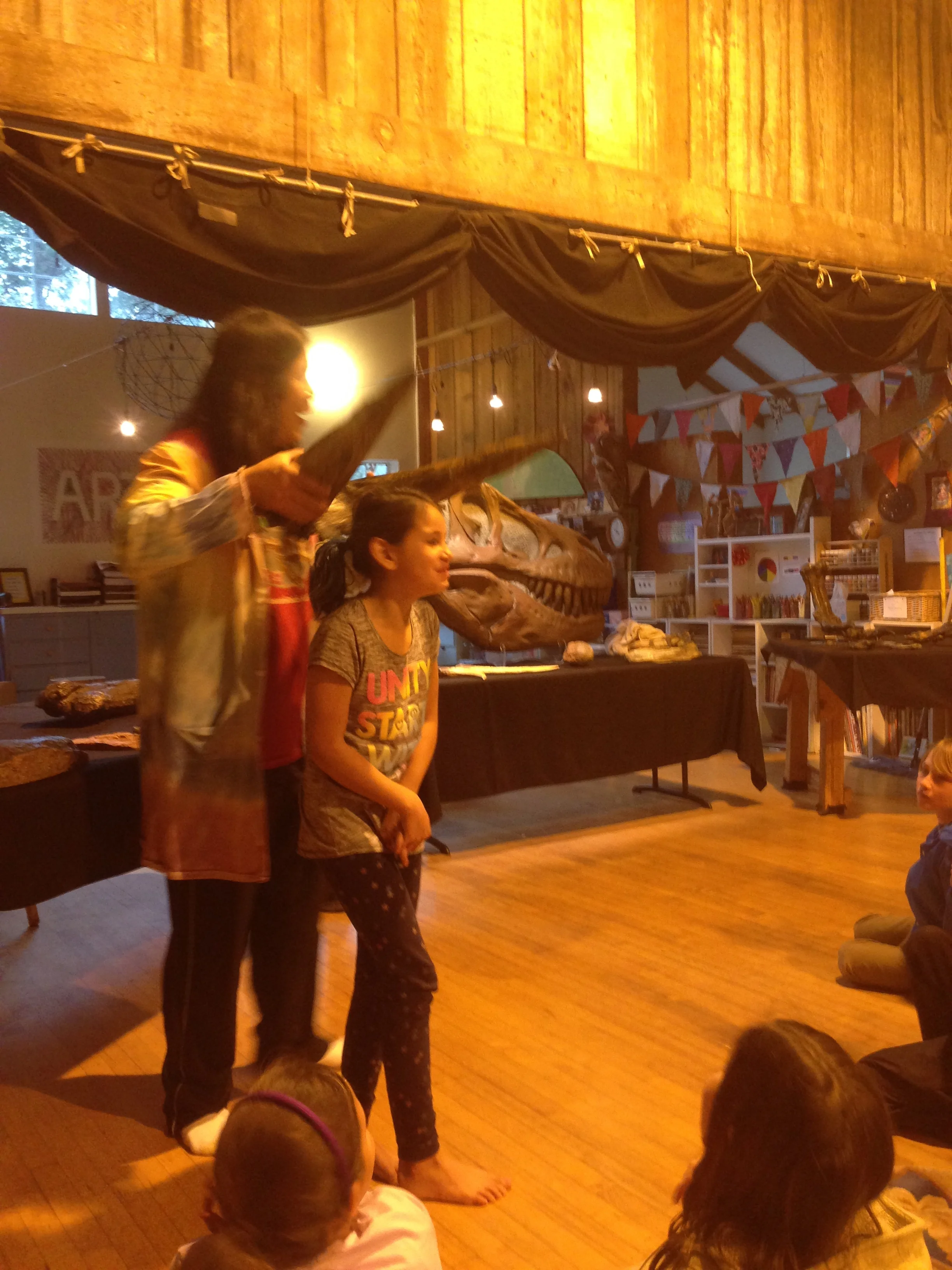 Trying on triceratops horns.