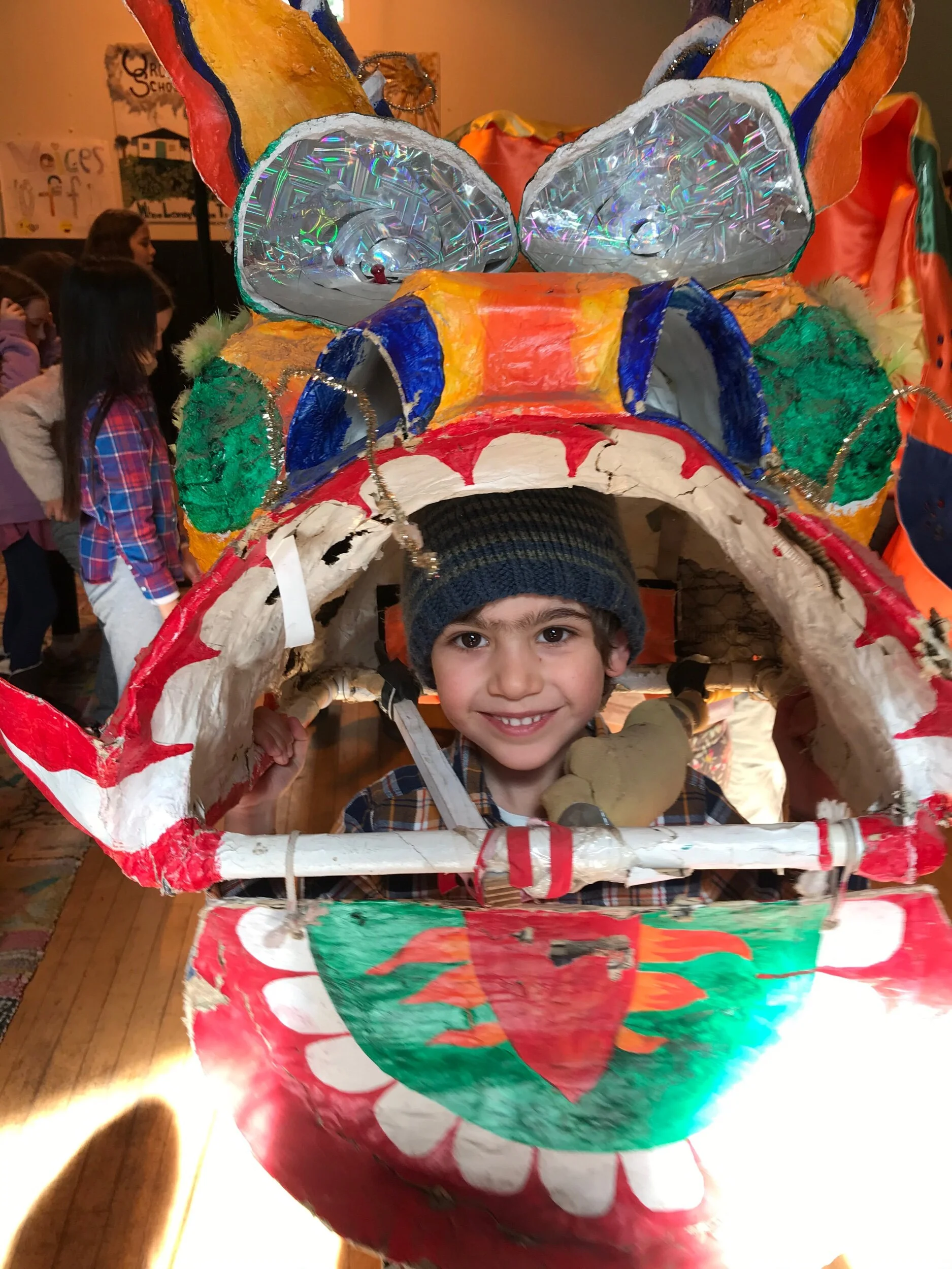 Asa lead the kindergarteners in the dragon dance across the fields and into and out of every classroom during the Chinese New Year celebration.