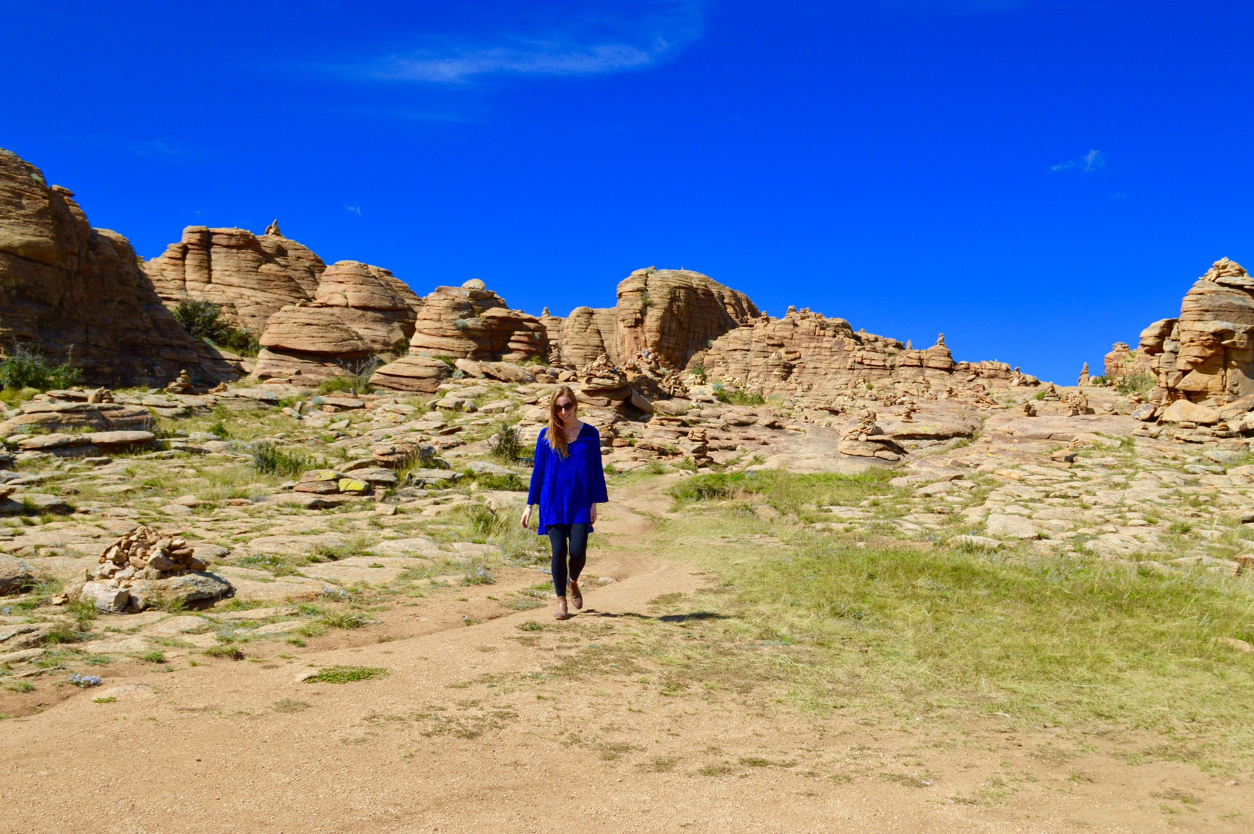 Bobbi walking back from the cave hidden in the hillside