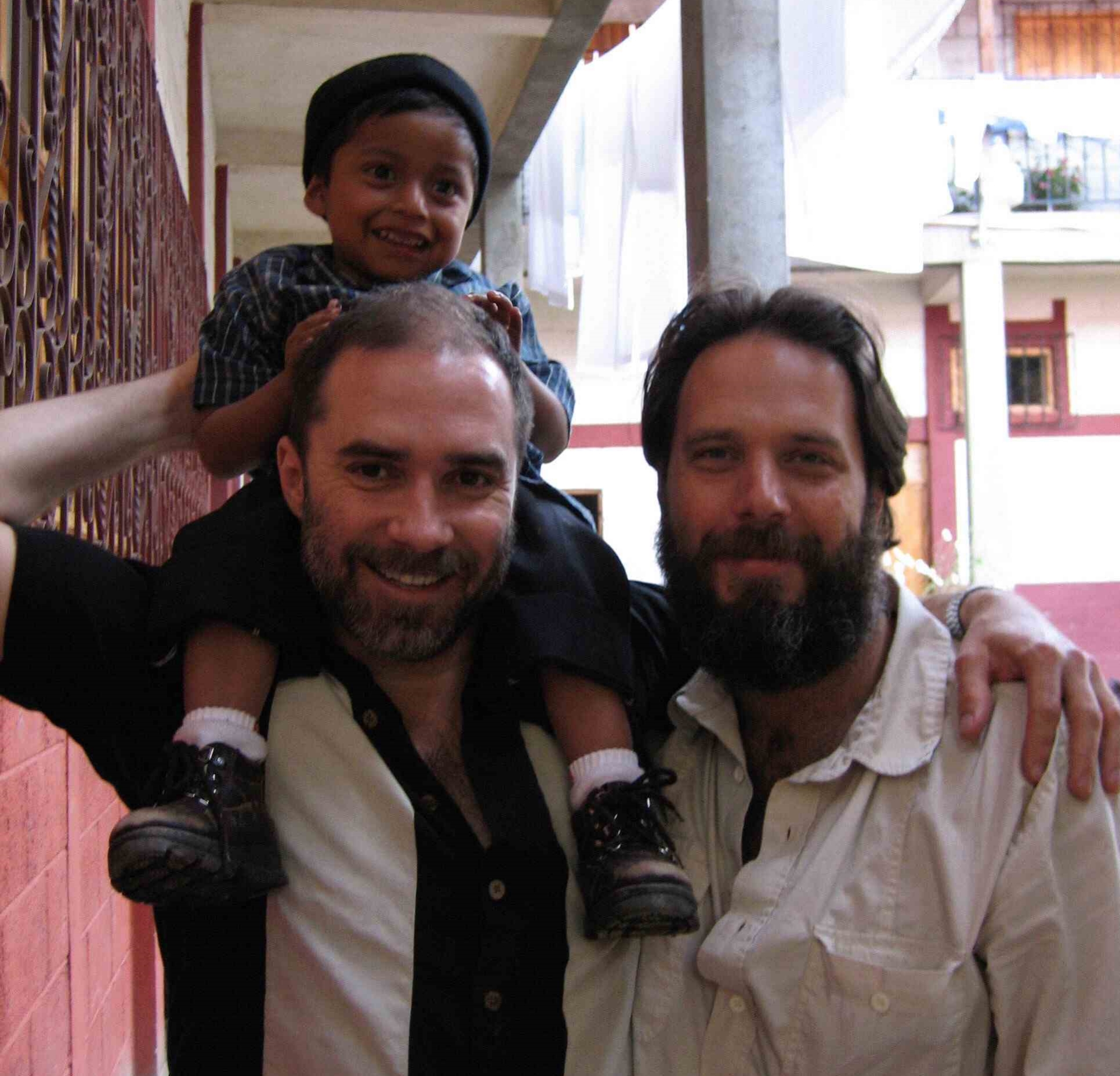 RWF Founder Jeff Cotter with volunteer Paul Stankiewicz and Rico at an orphanage in Santa Apalonia, Guatemala.