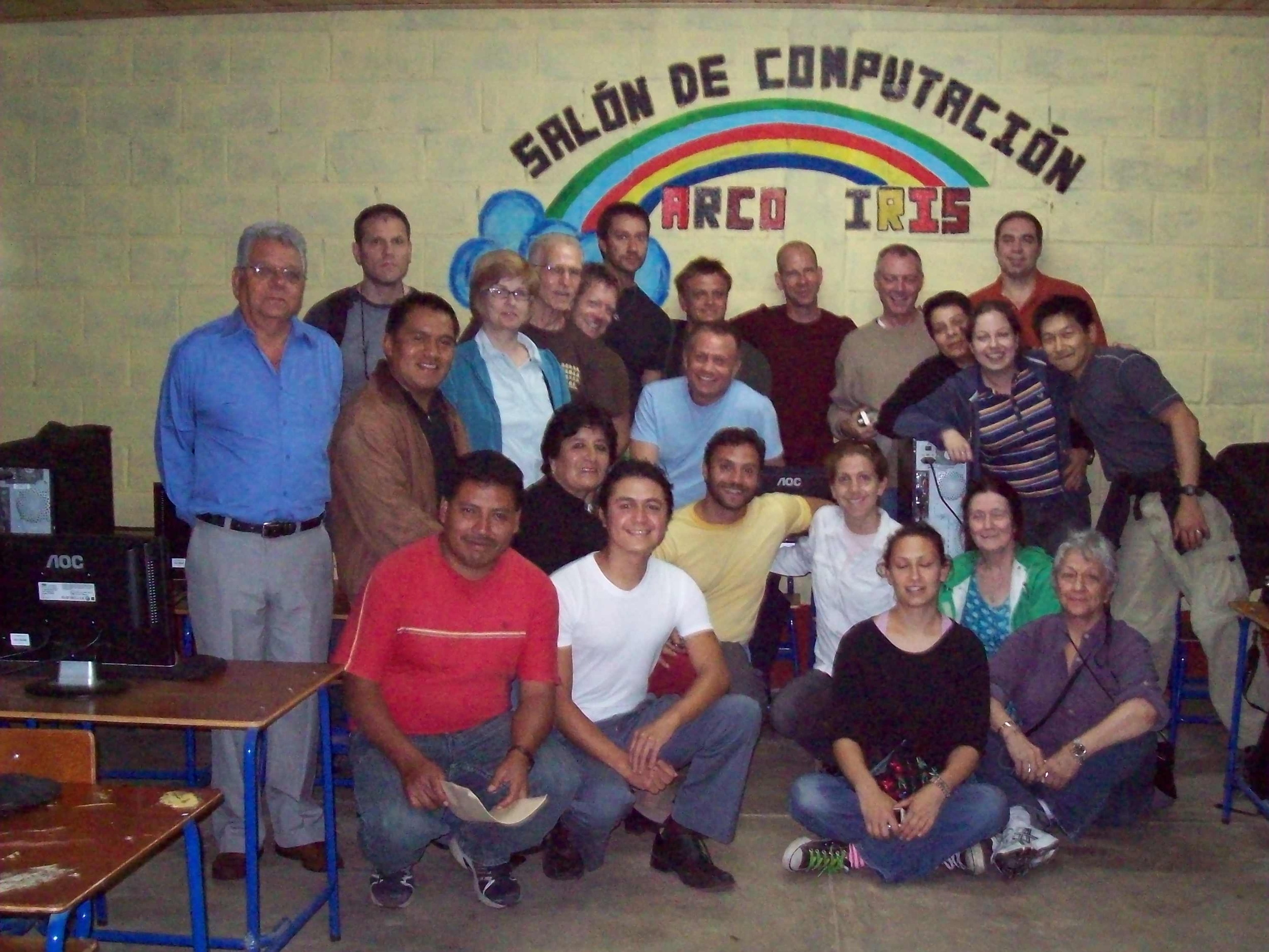 Volunteers visit the "Salon de Computacion Arco Iris" Rainbow computer lab that RWF funded at a high school in the Quiché Department in rural Guatemala.