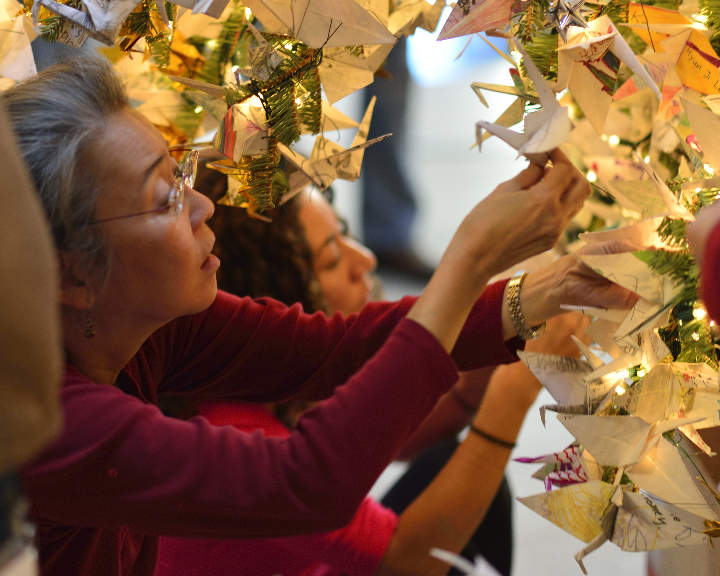 RWF Board Member Karen Kai decorating the Tree
