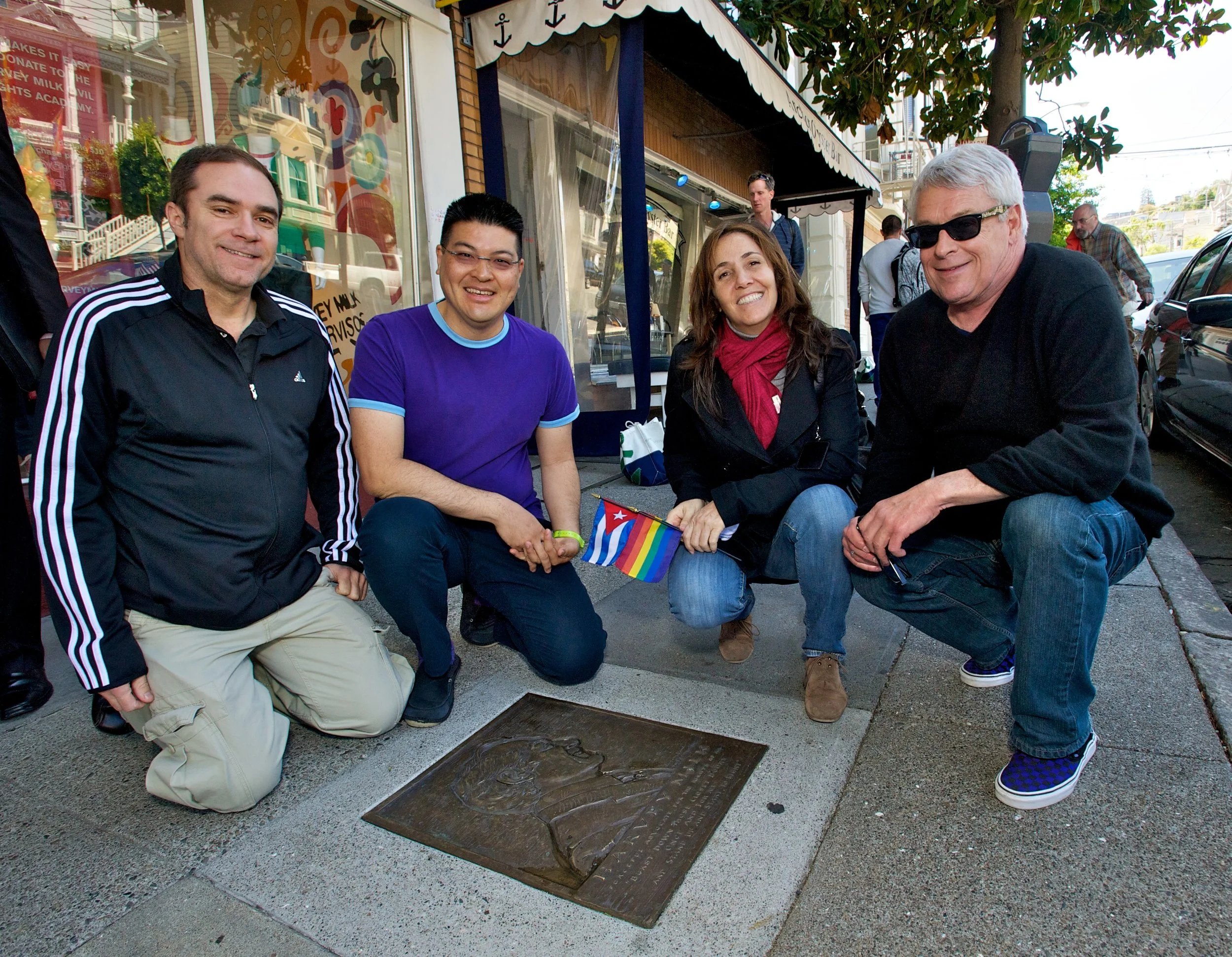 Jeff Cotter, Daniel Bao, Mariela Castro and Cleve Jones visit the Harvey Milk plaque on the Rainbow Honor Walk (2012)