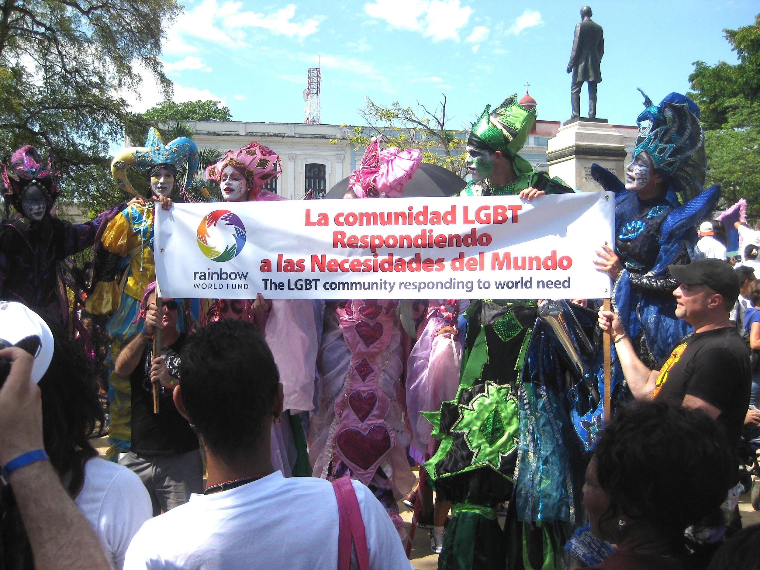 Rainbow World Fund volunteers hold a banner at the second city Jornada parade and celebration in Matanzas, Cuba (2015)