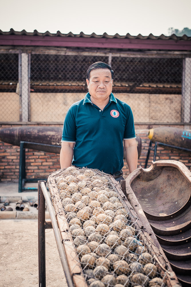 UXO Laos Provincial Coordinator Kingphet Phimmavong and a shell packed with 'bombies'. Of the 260m 'bombies that rained down, 80m failed to explode, leaving a deadly legacy. 