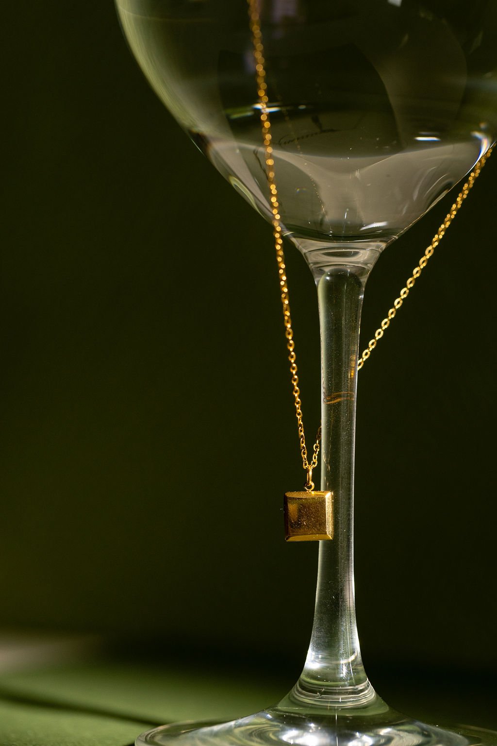 square-necklace-on-wineglass.jpg