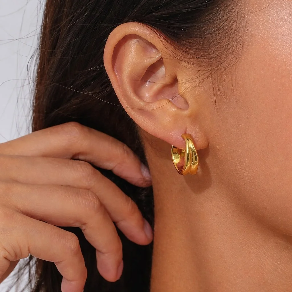 House Thirteen Molten Hoop Earrings worn on model, waterproof gold chunky hoop earrings