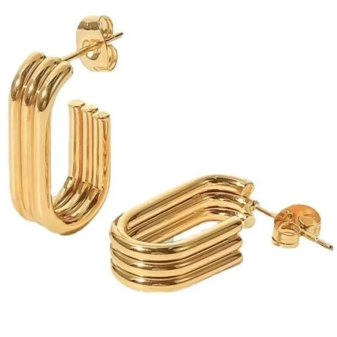 House Thirteen Trio Hoop Earrings on white ceramic surface, tarnish resistant gold triple hoop earrings