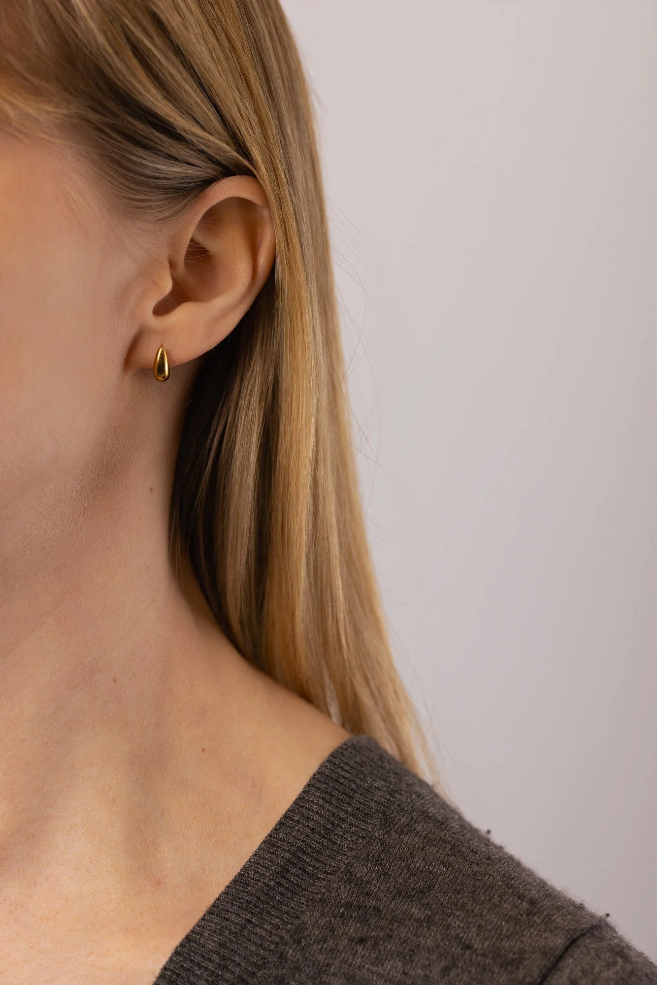 House Thirteen Teardrop Stud Earrings worn on model, minimalist gold teardrop stud earrings