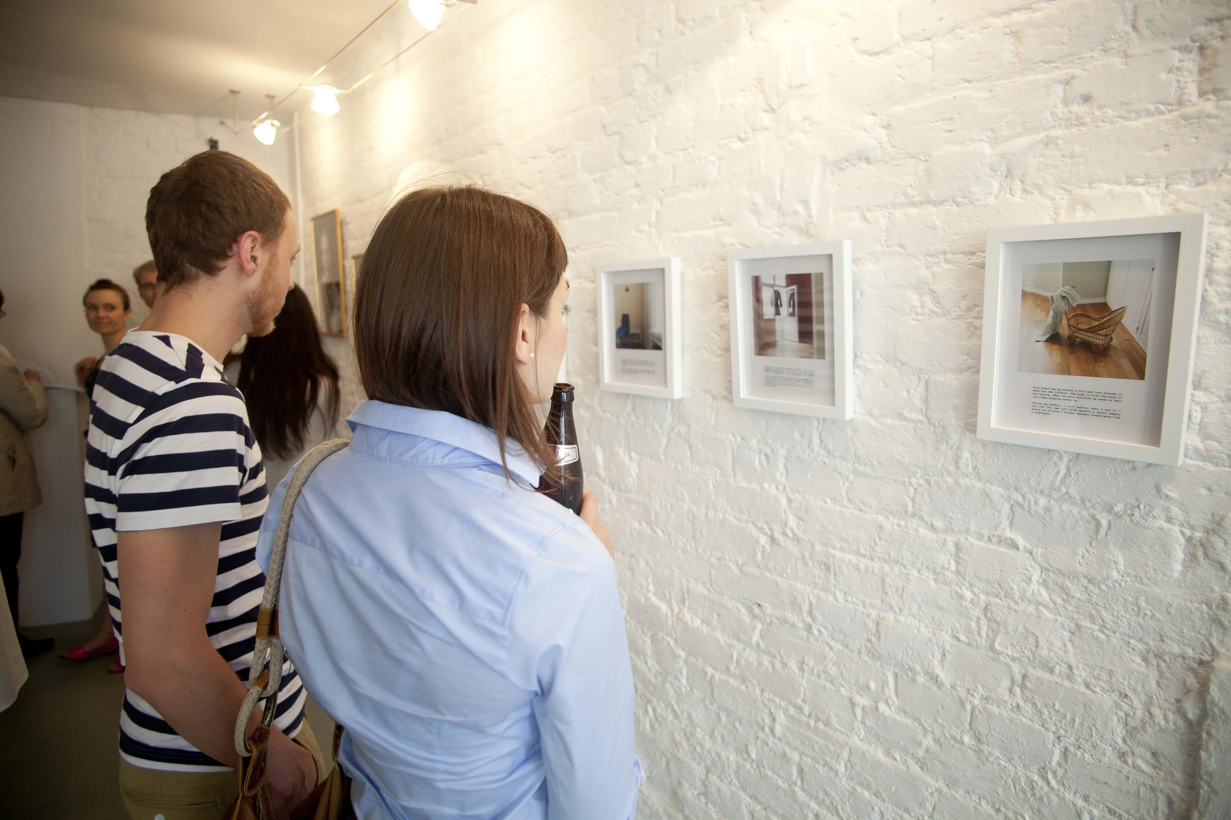 Visitors at an art gallery opening at Green Lens Studios in Haringey