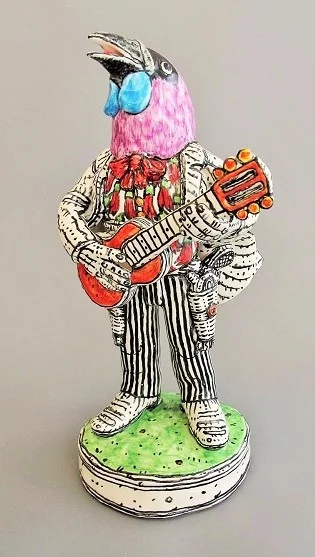 Singing Kokako with guns and guitar by Chuck Joseph.