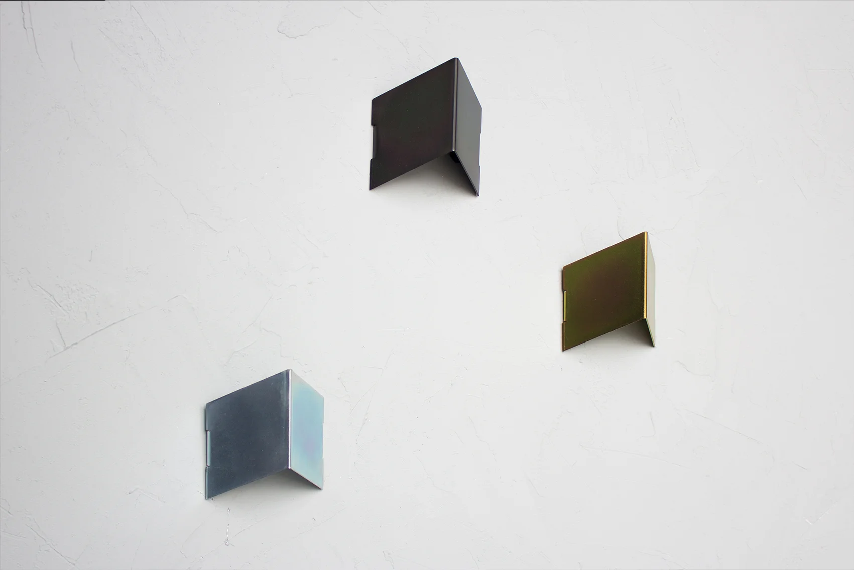 Fold wall hooks in three zinc finishes