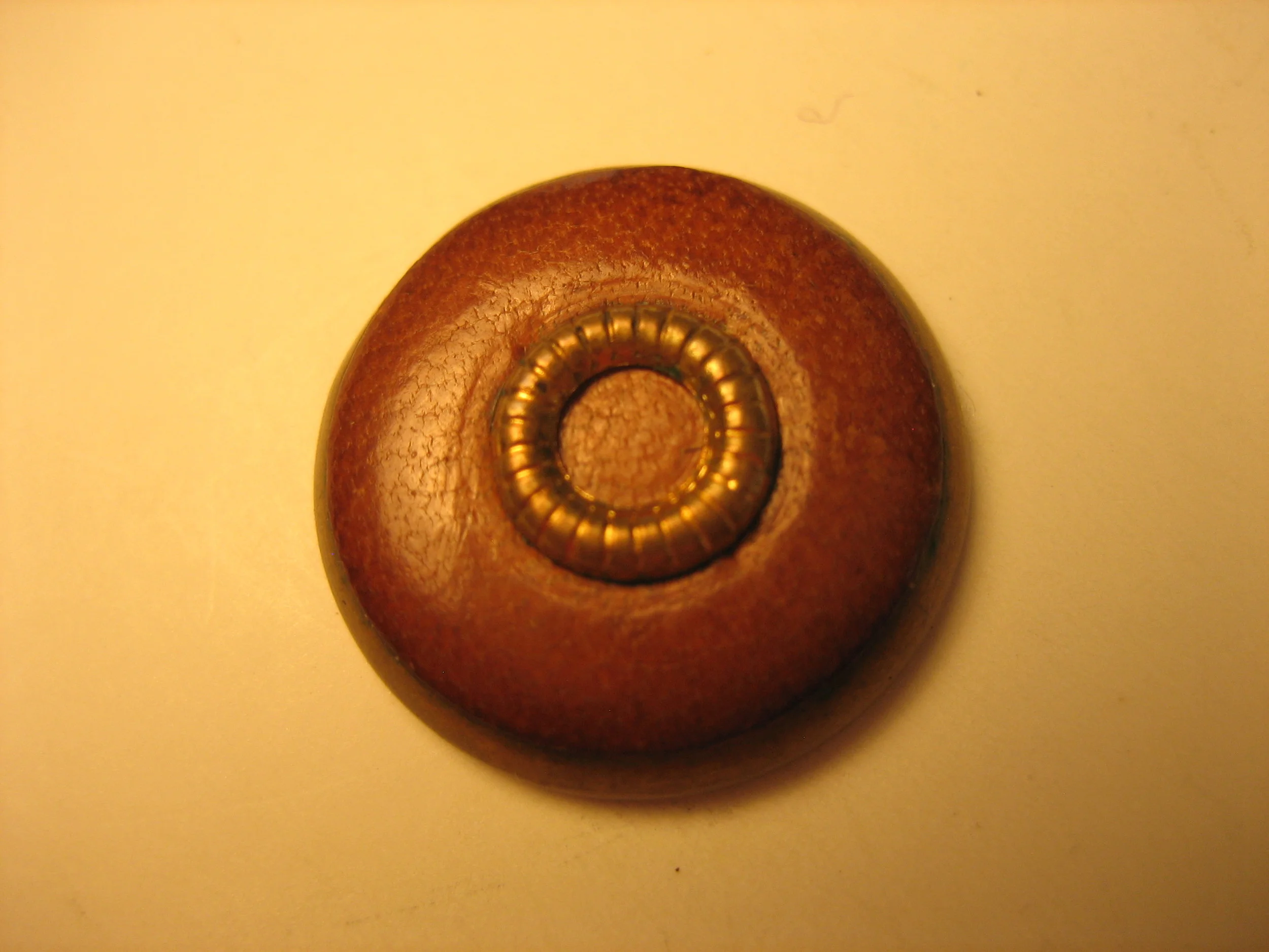 Metal-trimmed Leather Button