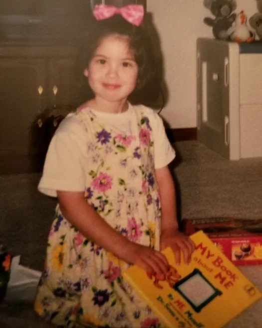 Nicole has always been a reader! Here she’s clutching her copy of “My Book About Me” in kindergarten!