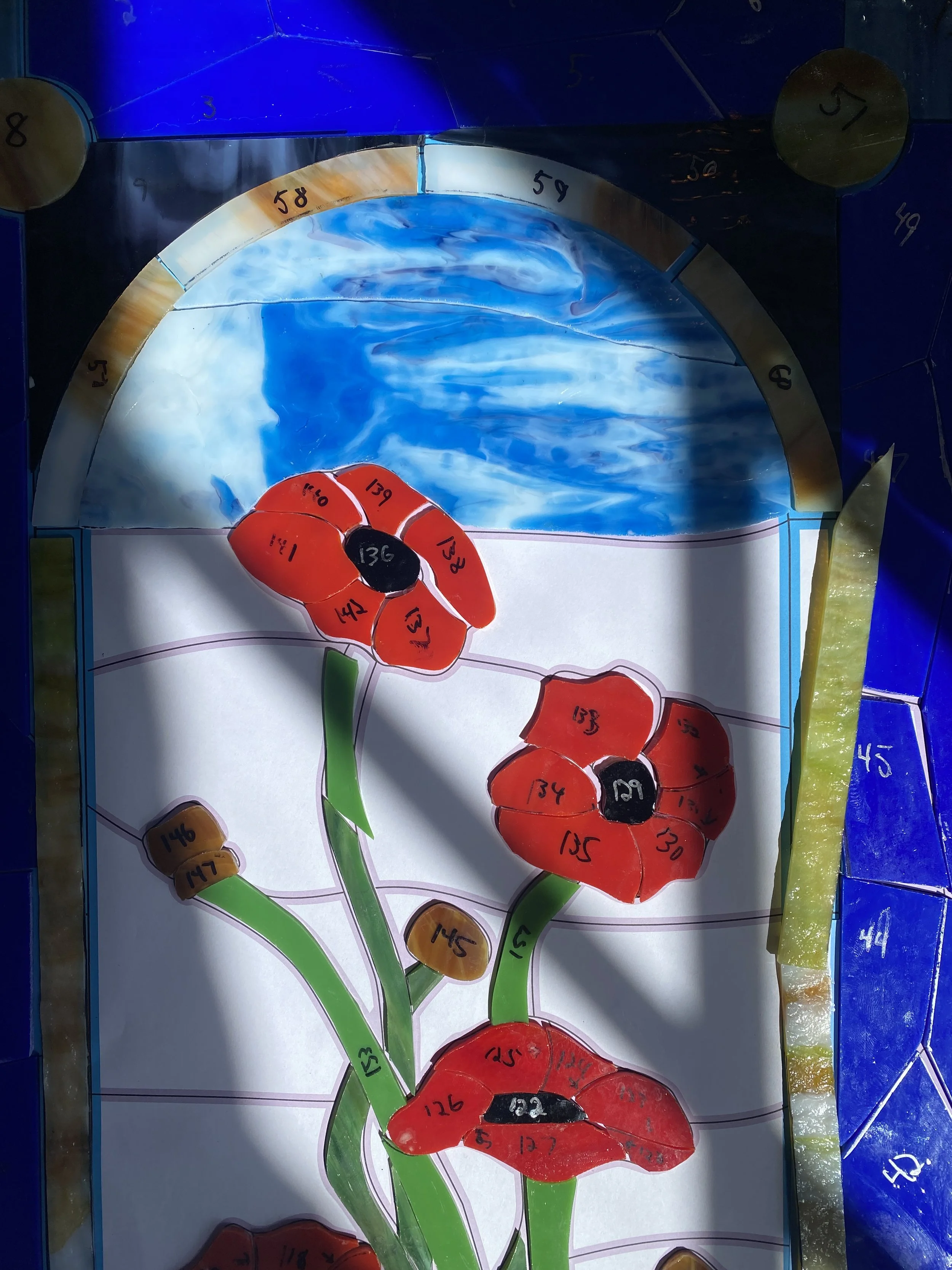 Multifoil stained glass window in Dickson Memorial Chapel at Greenlawn Cemetery in Salem, MA