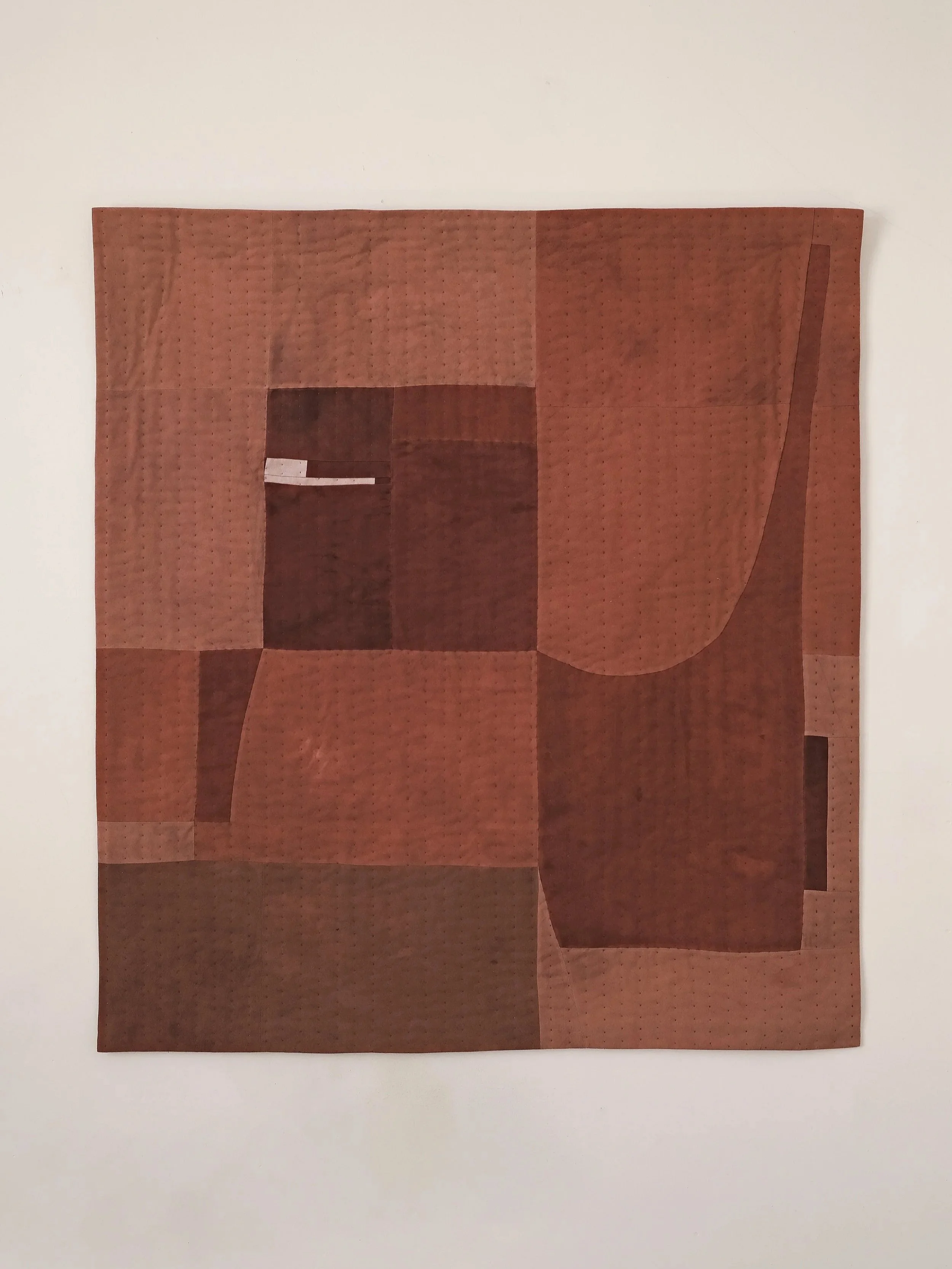 An abstract quilted wallhanging, hand dyed with Madder by House of Quinn