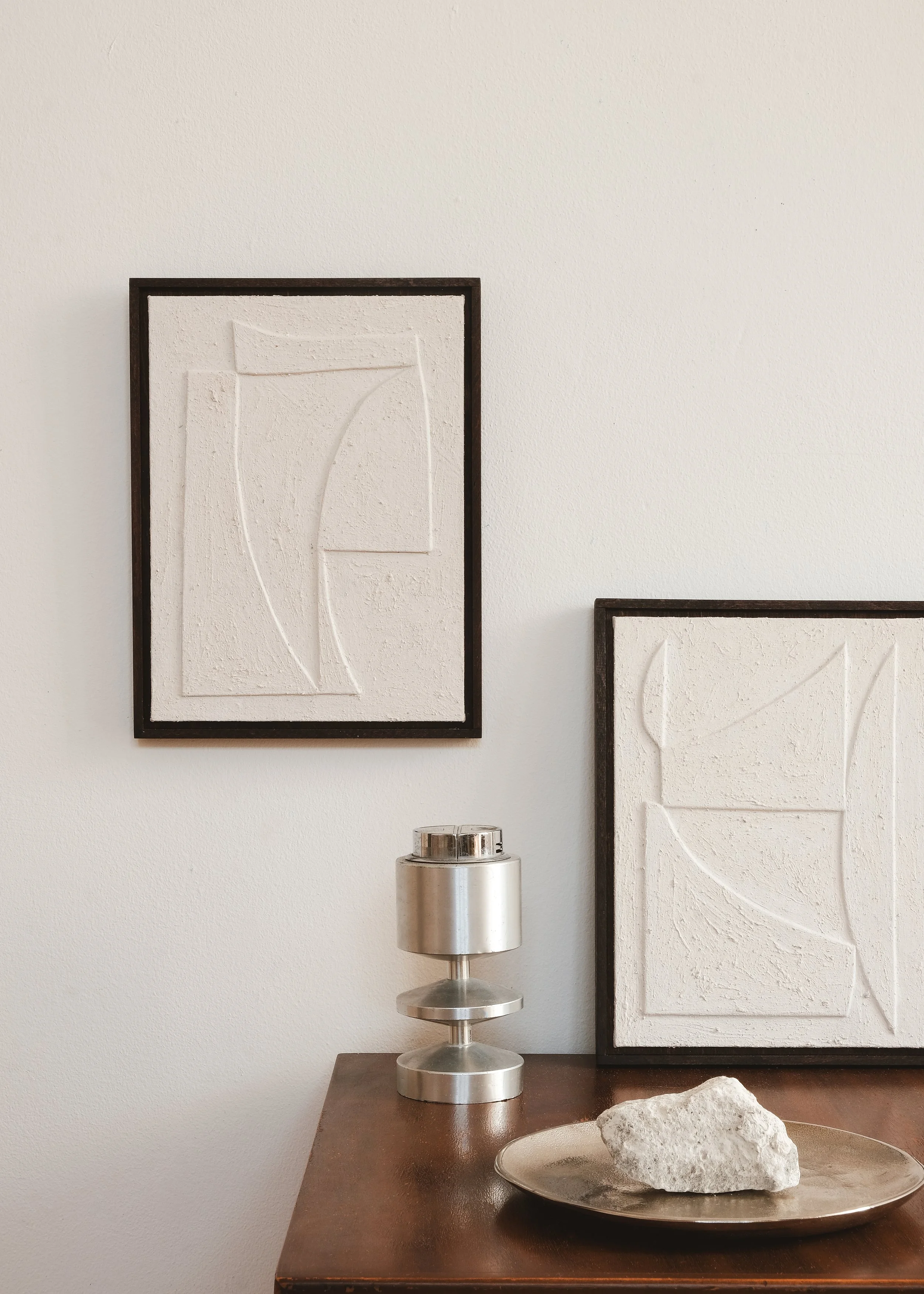 House of Quinn paintings featured within a minimalist interior.