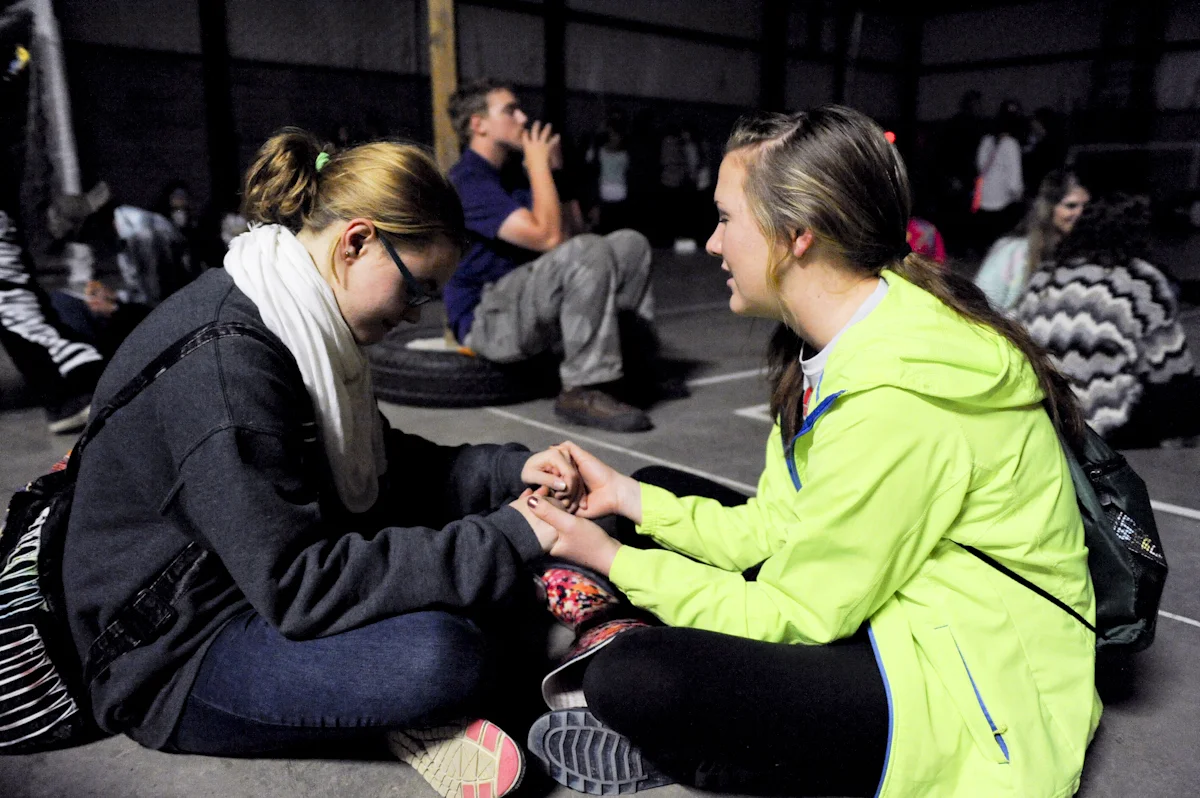 Students pray for each other and their campus during Fall Retreat.