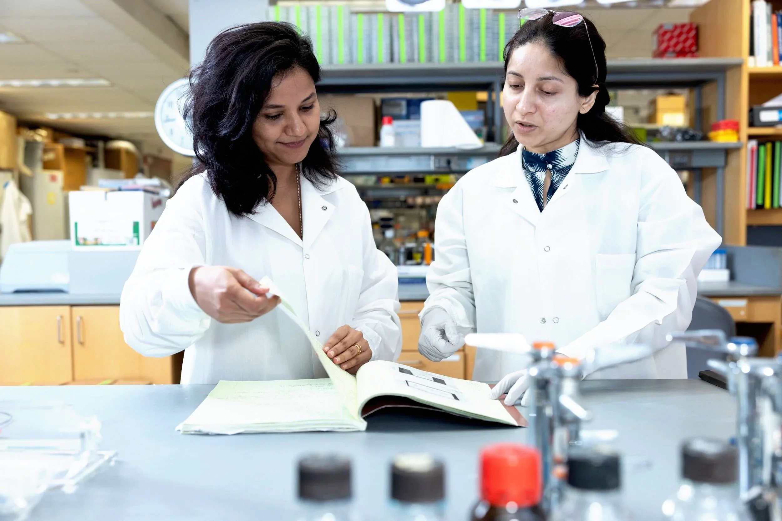 Two women scientists in a lab doing research