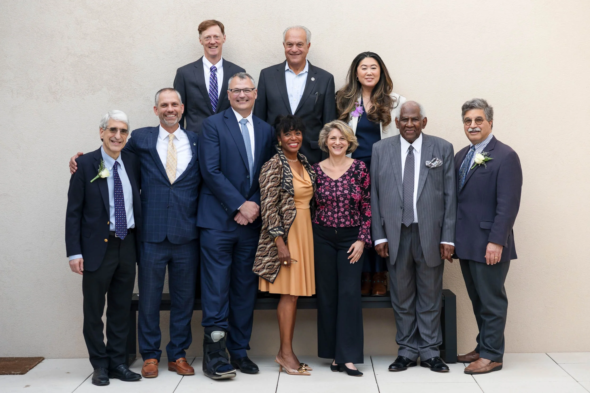 Group portrait of nonprofit board members and organizational leaders standing together for a formal photograph.