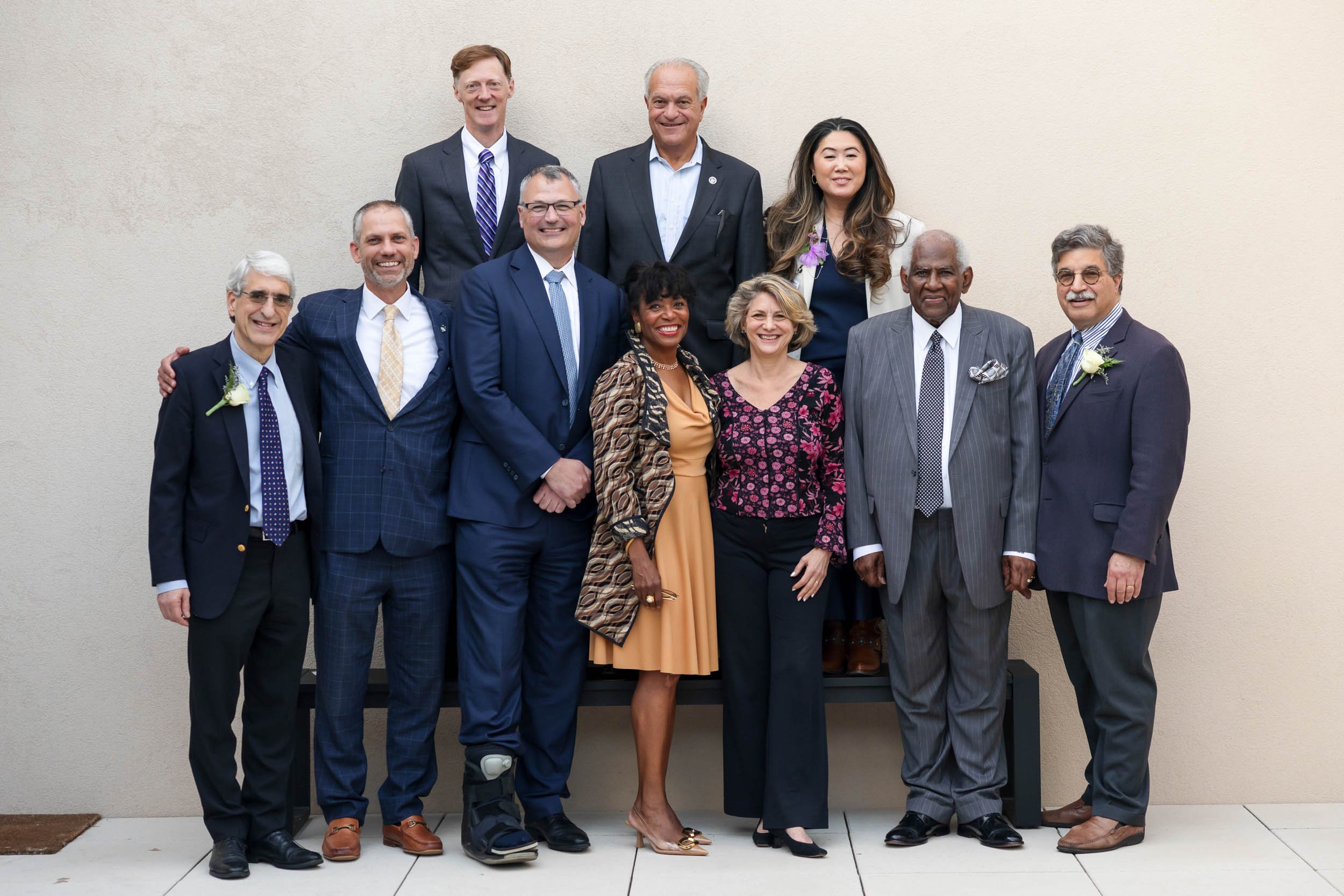 Group portrait of nonprofit board members and organizational leaders standing together for a formal photograph.