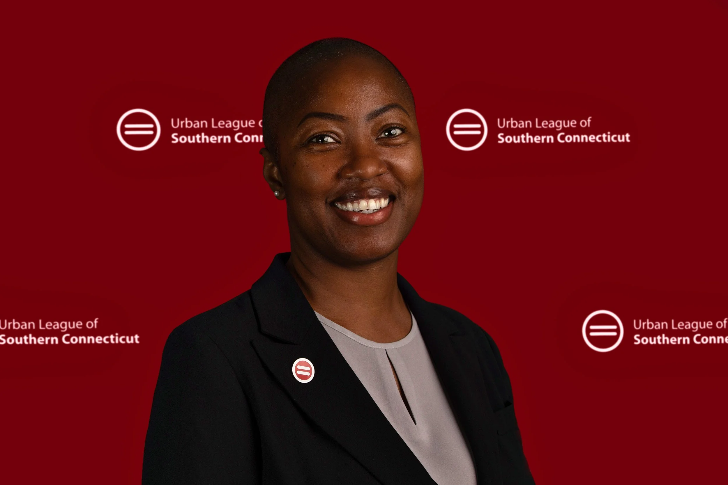 Headshot of a woman that works for the Urban League of Southern Connecticut which is displayed on the background