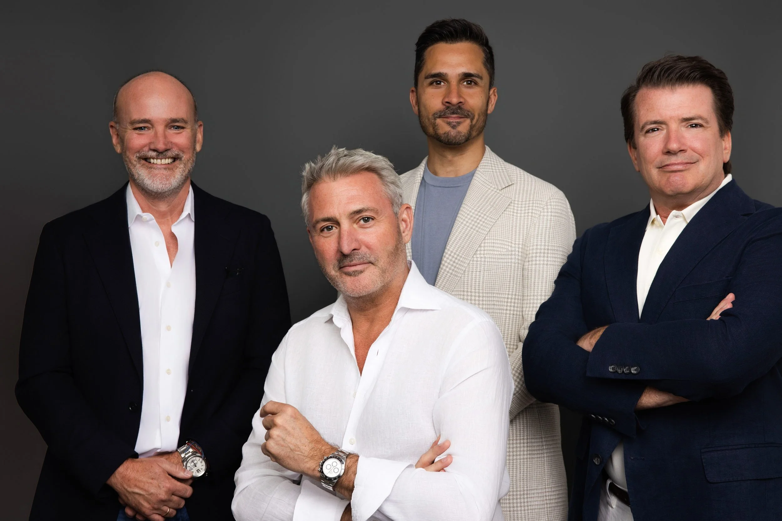 Four professionals photographed together during a corporate team headshot session in Connecticut.