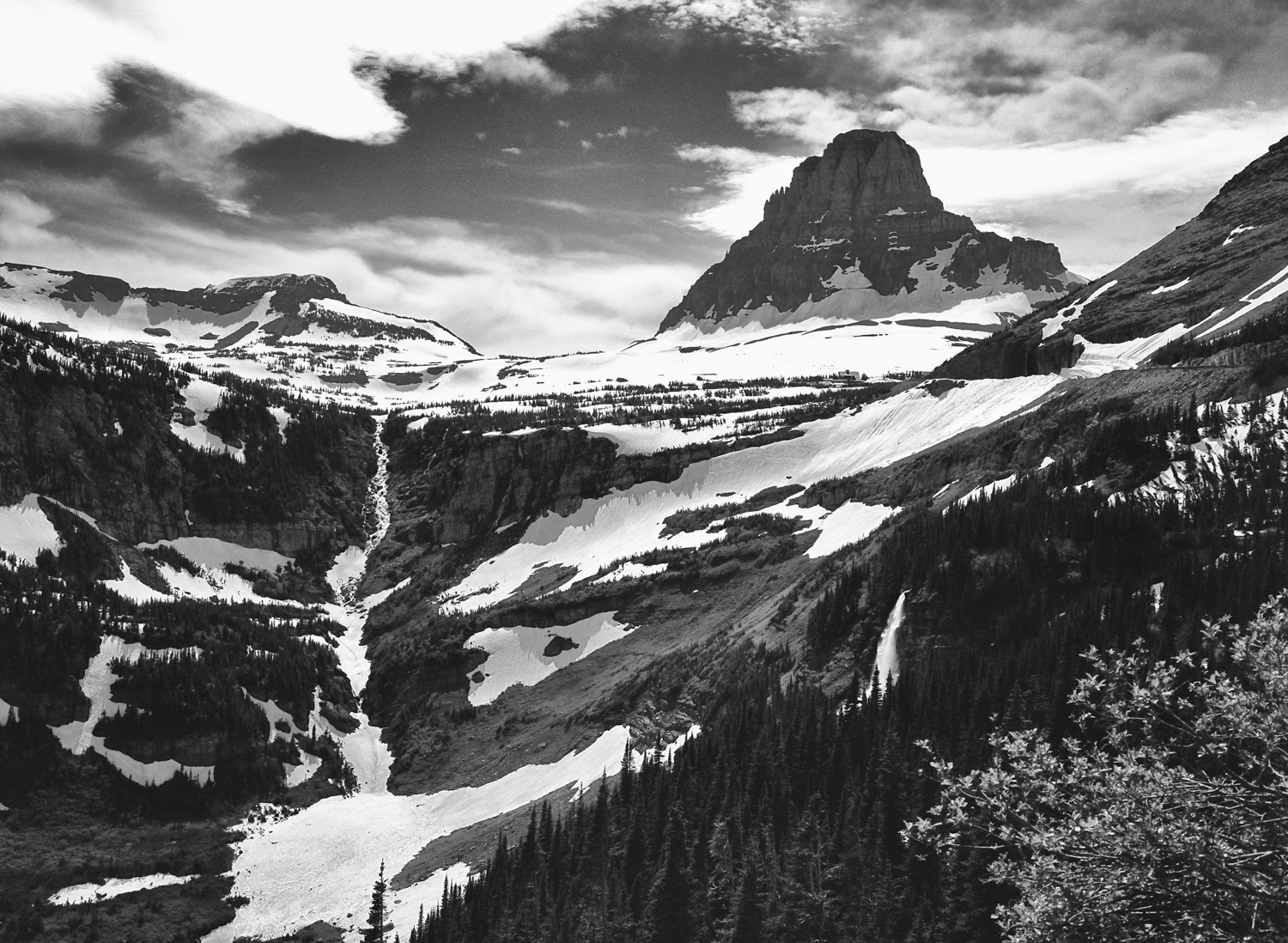 I made my first trip to Logans Pass on the 4th of July this year. The NPS workers finally had the pass cleared of snow the previous day. This photo is a prime example why Black & White film works so well for landscape shots such as this. 